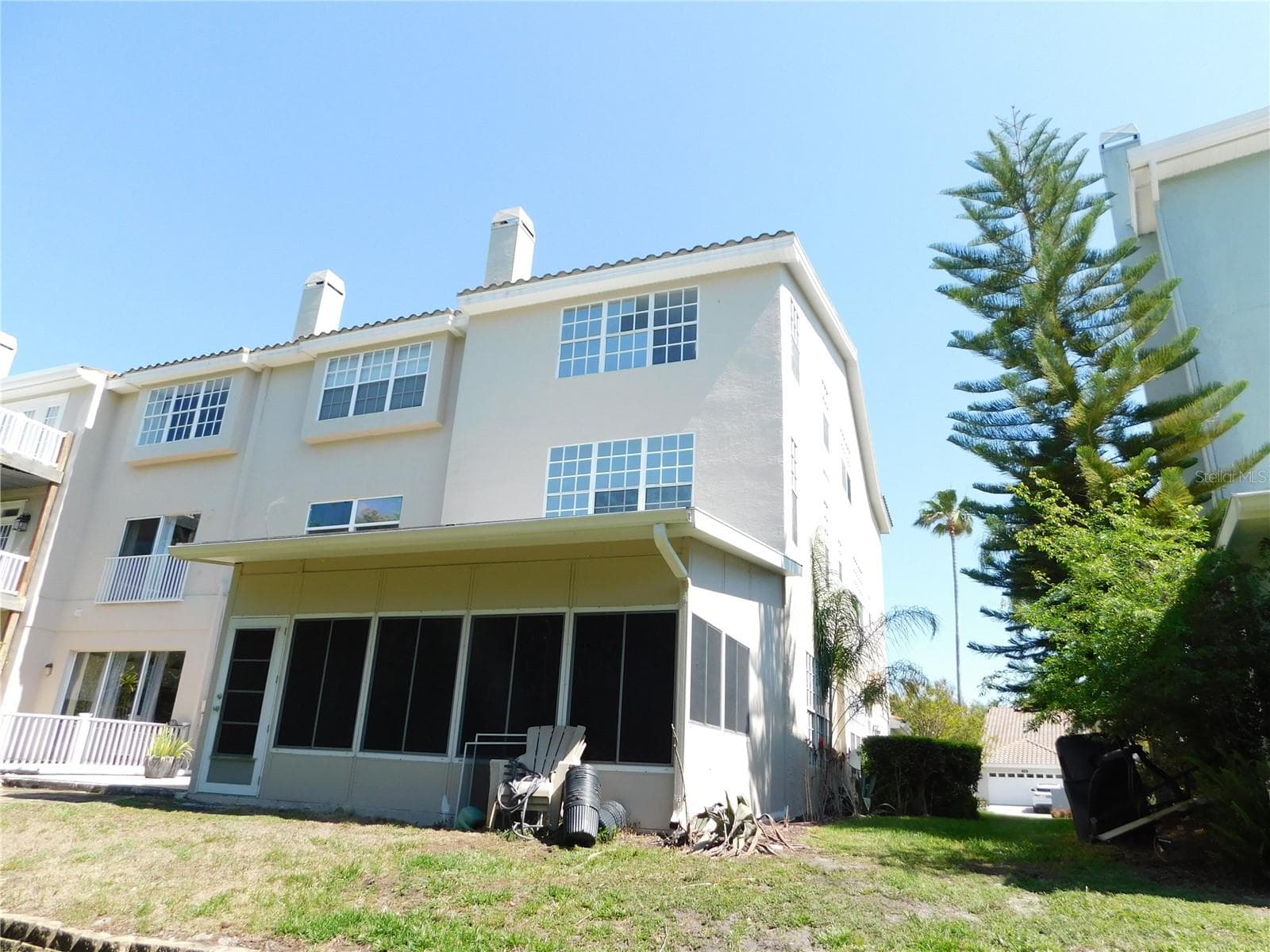 Back view of Florida Room and 3 stories of the home - 1720 ARABIAN LN, PALM HARBOR