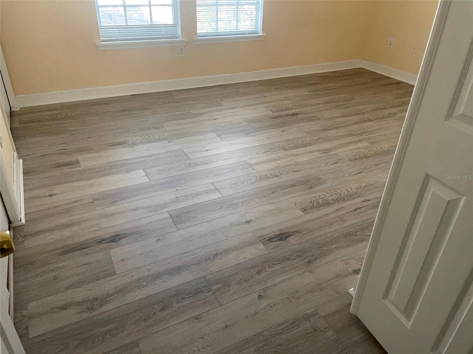 New luxury vinyl floor in 2nd bedroom on 2nd floor - 1720 ARABIAN LN, PALM HARBOR