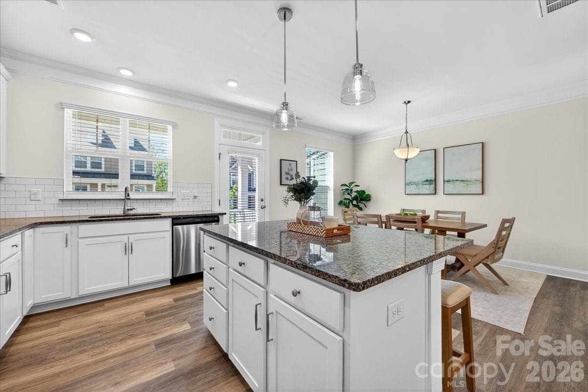 Granite countertops and tons of storage in Kitchen Island. - 10436 Glenmere Creek Circle, Charlotte