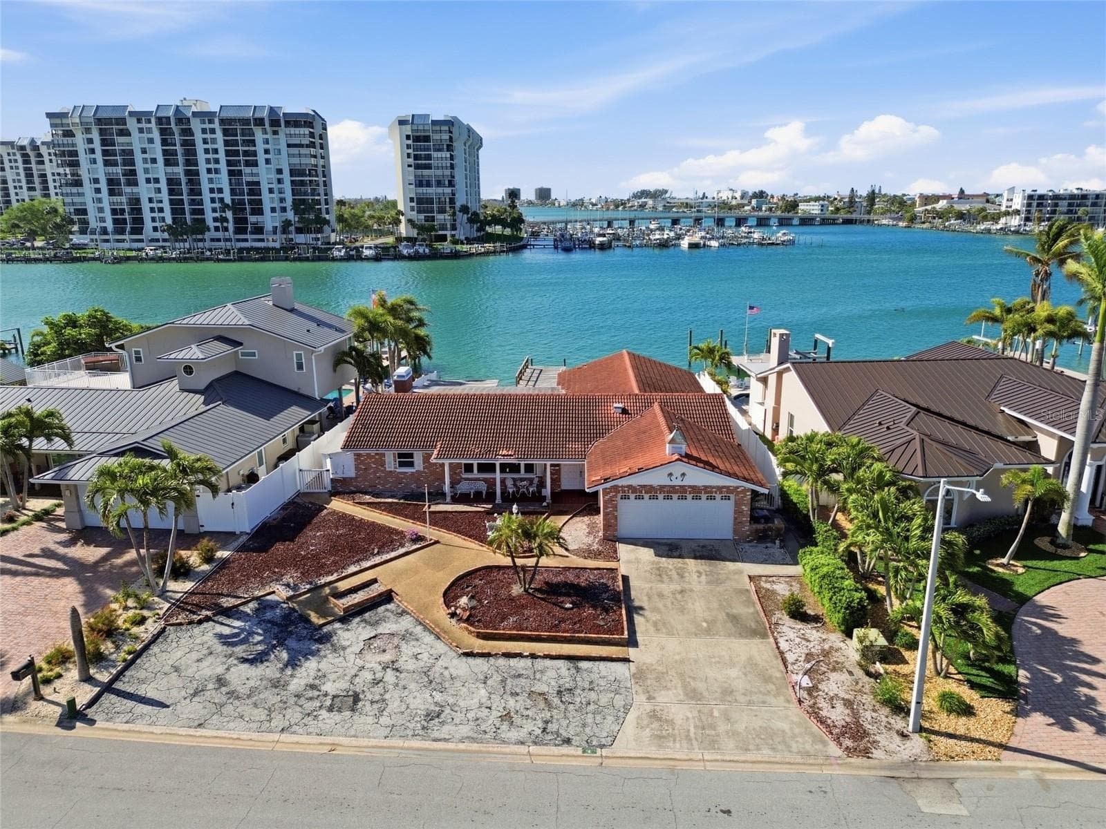 Drone shot of existing structure on 4 Bellevue Dr looking south at The Devil's Elbow on the Intracoastal and the one bridge to the Gulf in the foreground on the right. - 4 BELLEVUE DR, TREASURE ISLAND