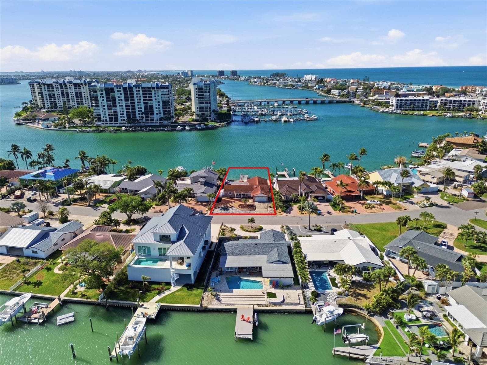 Drone shot looking down at 4 Bellevue and south to The Devil's Elbow and beyond the bridge leading to the beaches and the Gulf (the intracoastal contunues south on the left side). - 4 BELLEVUE DR, TREASURE ISLAND