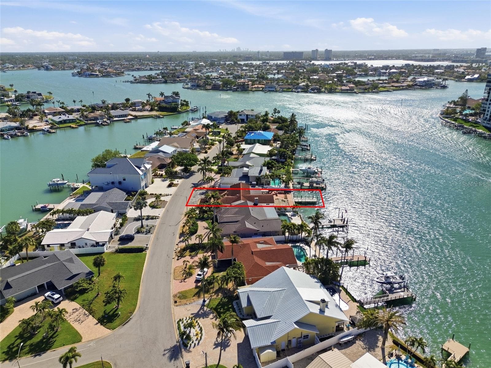 Drone shot looking east on tranquil Bellevue Drive with 4 Bellevue highlighted in "red".  Most homes have already been remediated or are in the process.  The street is a cul-de-sac with very little traffic other than neighbors. - 4 BELLEVUE DR, TREASURE ISLAND