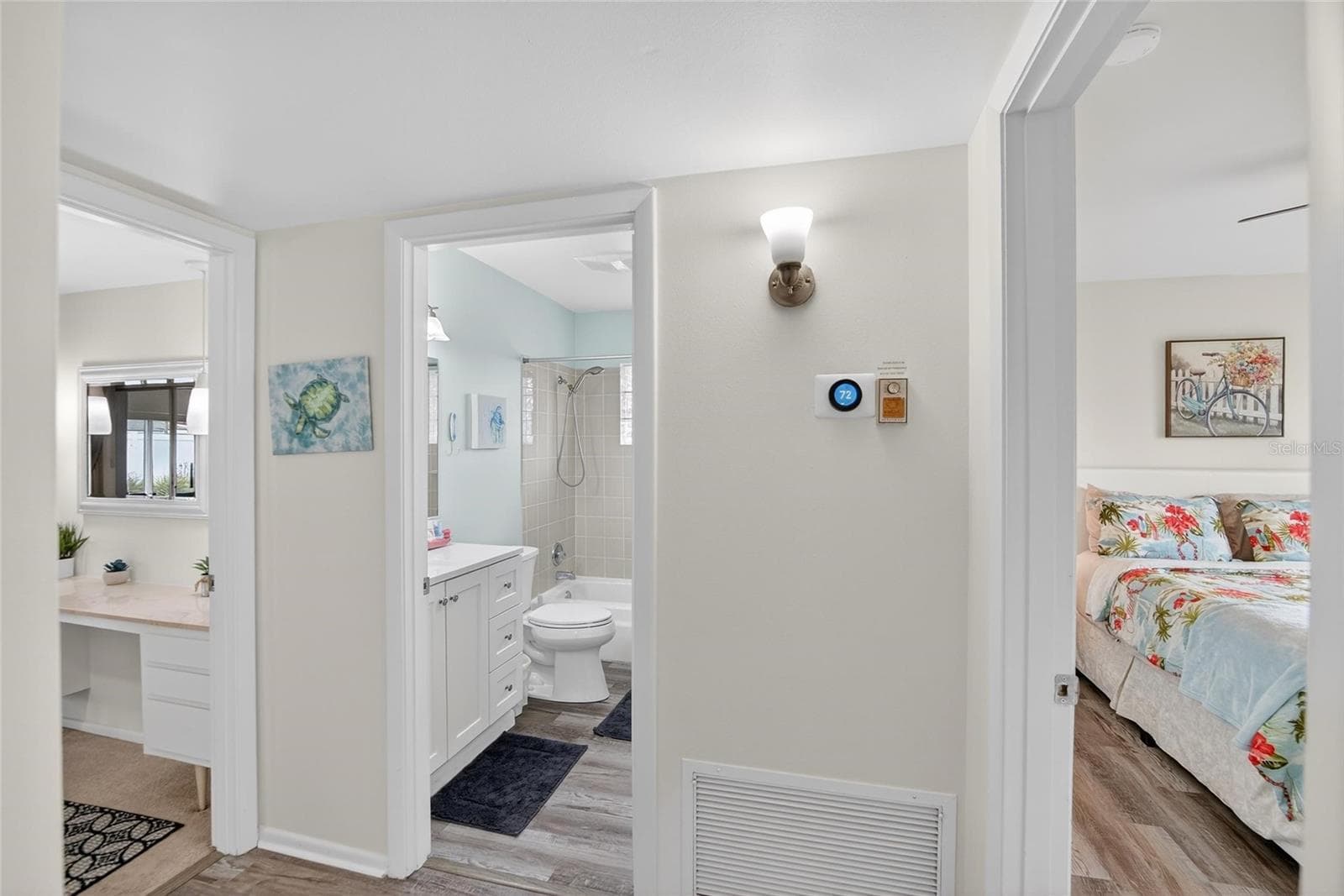 Hallway view with Primary Bedroom (left) and 2nd Bedroom (right) - 809 OAKMONT AVE, SUN CITY CENTER