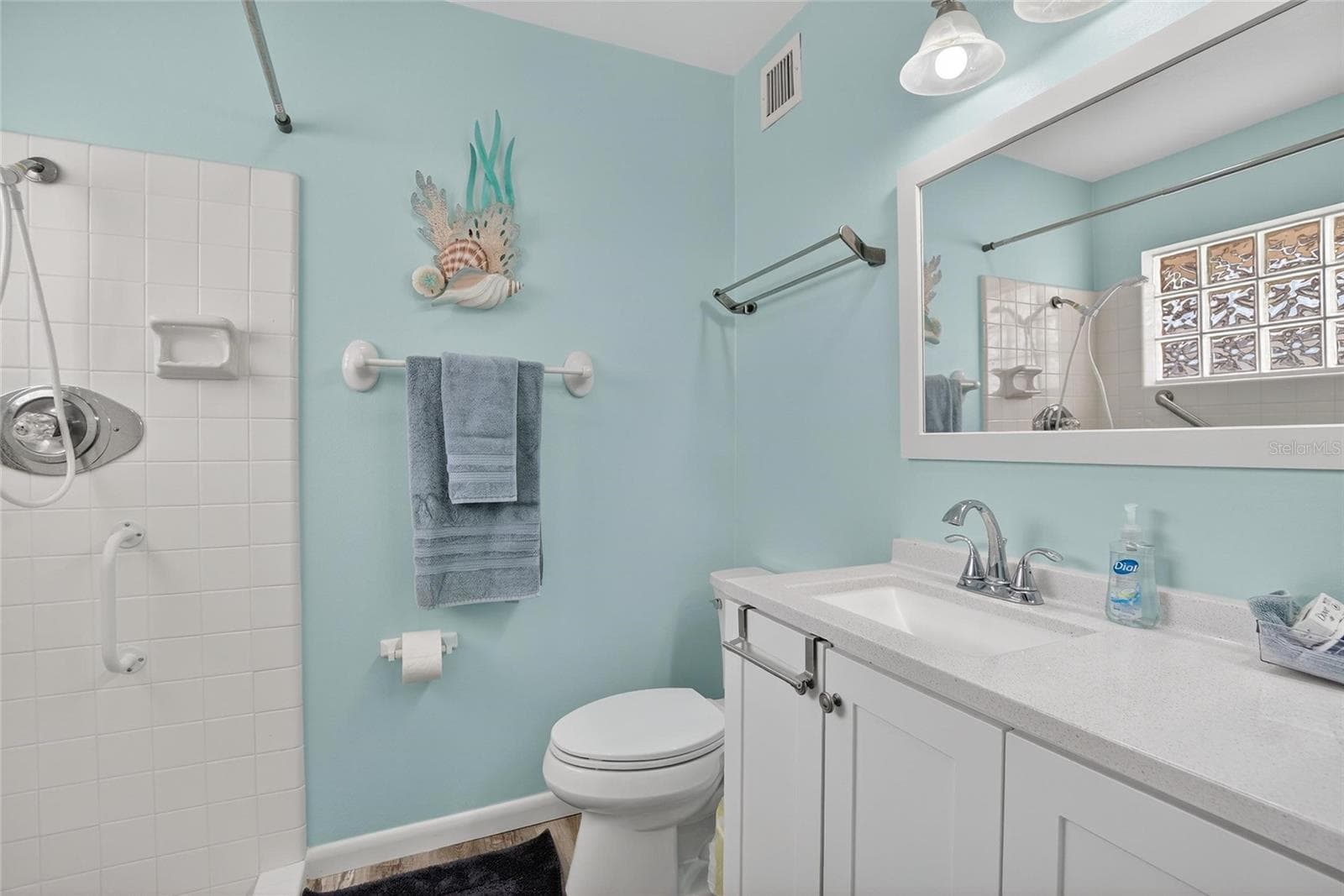 Updated primary bathroom with plantey of storage - 809 OAKMONT AVE, SUN CITY CENTER