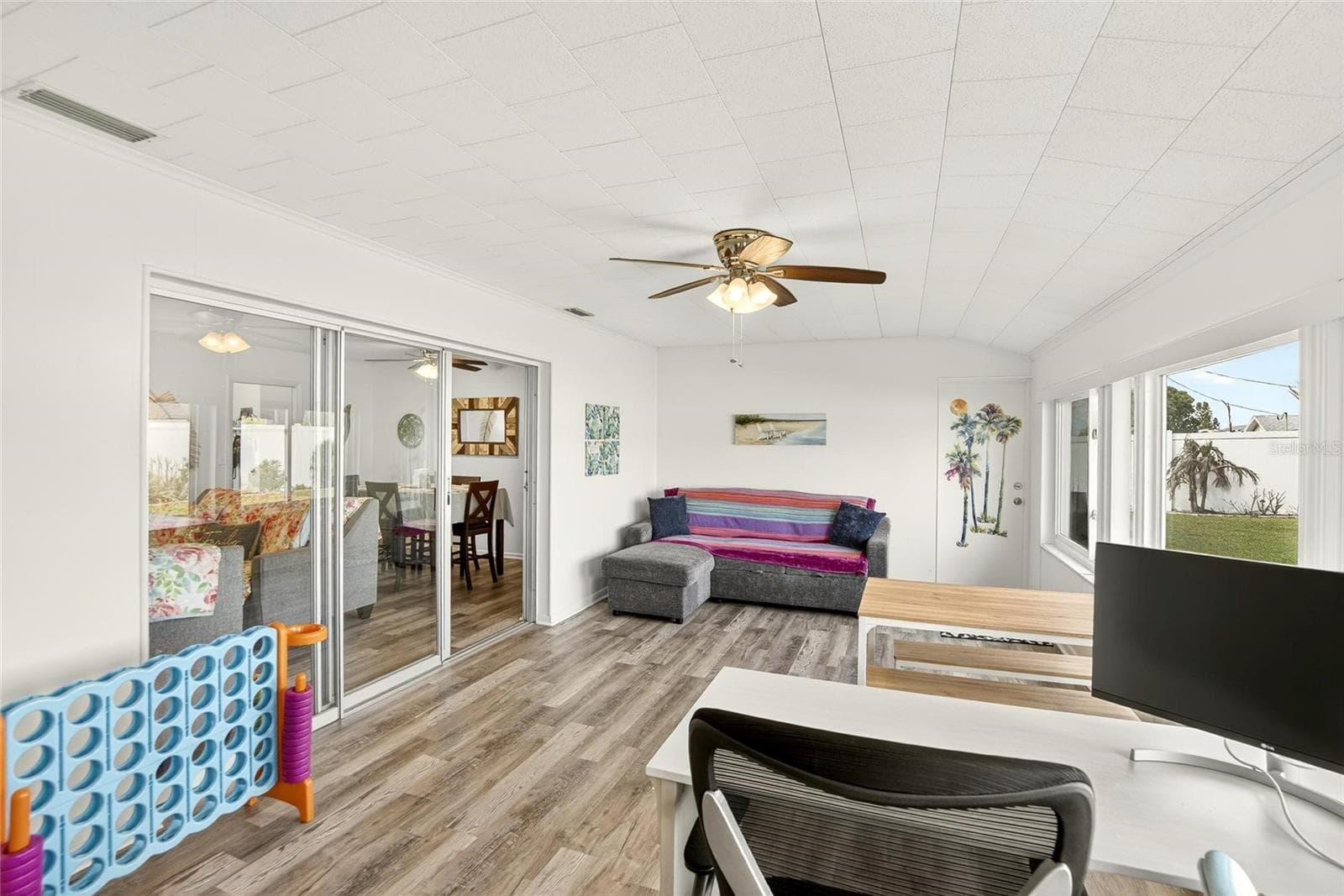 Open to the rest of the home, this space allows you to always feel as part of the activity that is going on. - 809 OAKMONT AVE, SUN CITY CENTER
