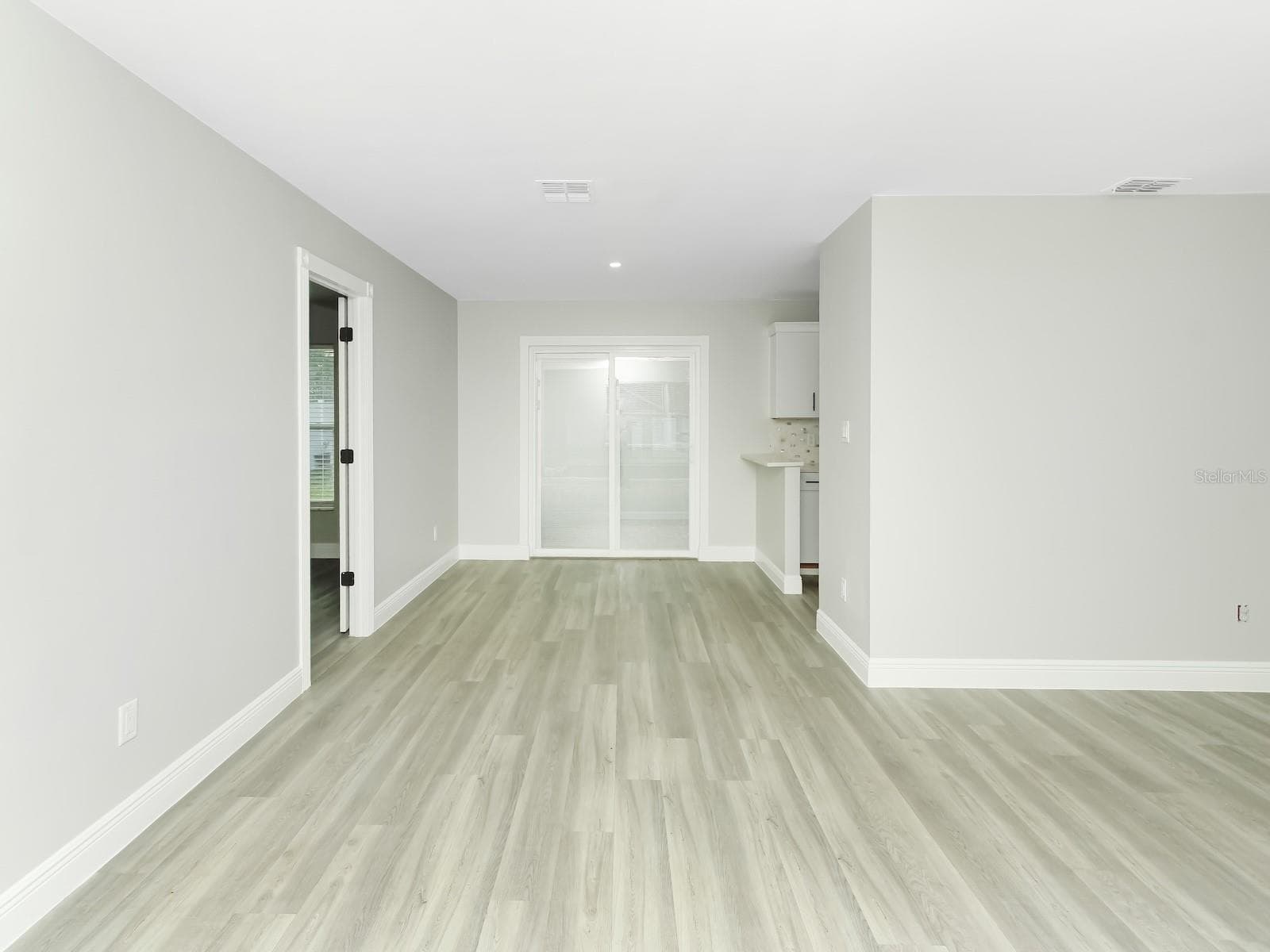 living room and dining - 919 SYLVIA DR, DELTONA