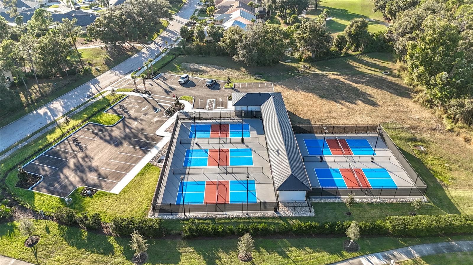 Ample parking for cars, golf carts and bicycles at the pickle ball center - 7015 PLEASANT HILL RD, BRADENTON