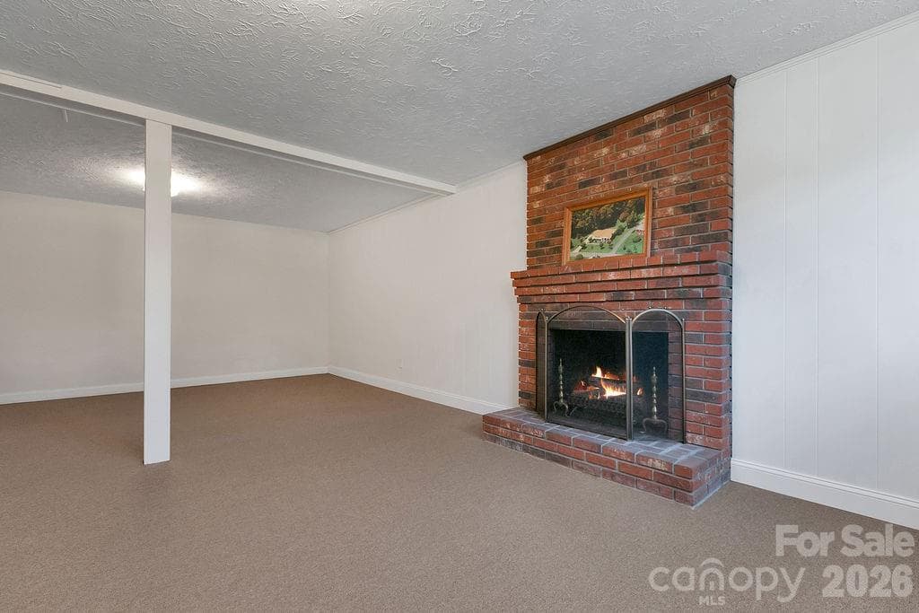 Fireplace in Basement - 1482 Island Ford Road, Brevard