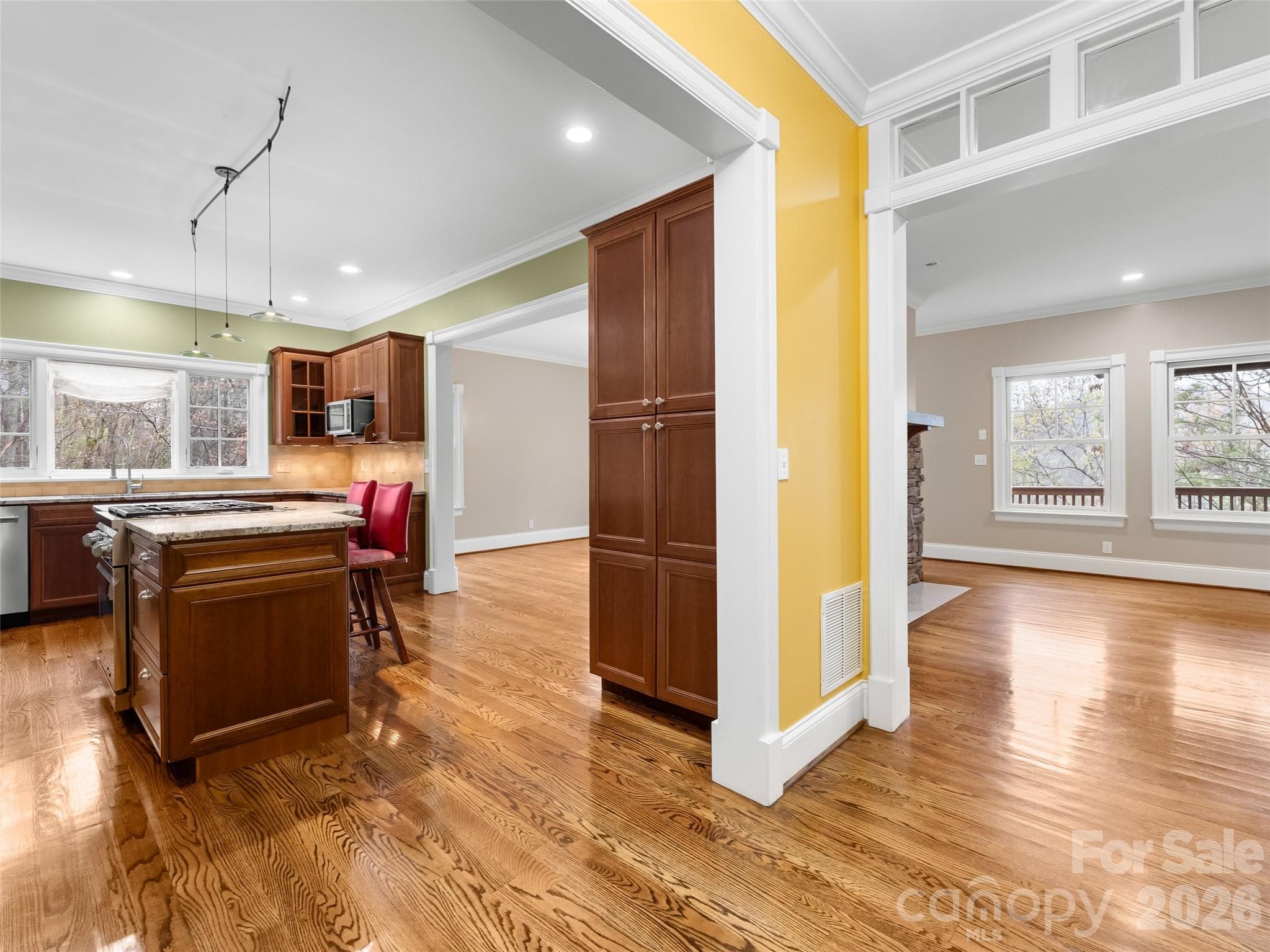 As you enter the home, you're greeted with a bright and spacious kitchen, dining and living areas. - 5 Stegall Lane, Asheville