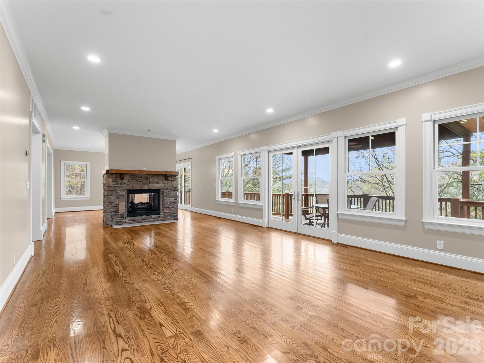This oversized living room offers plenty of natural light and sunset mountain views. - 5 Stegall Lane, Asheville