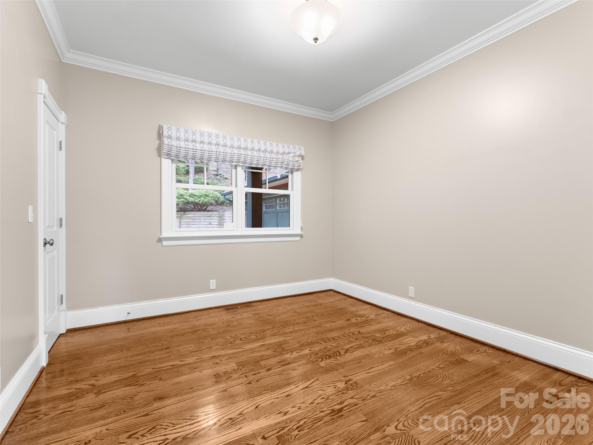 The 2nd bedroom on the main level could be used as a guest room or office and has an en-suite bathroom as well. - 5 Stegall Lane, Asheville