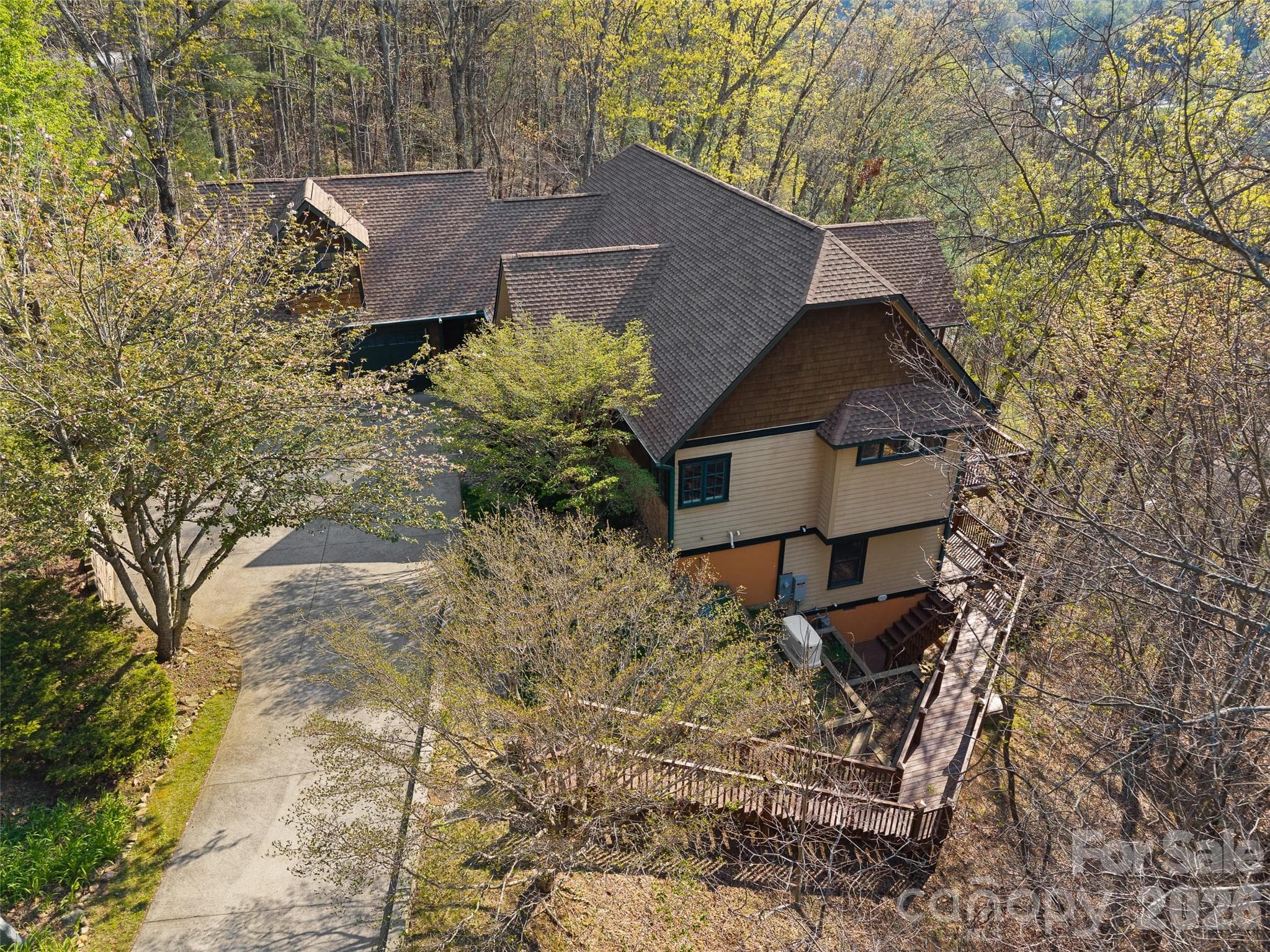 Exterior stairs lead down to the lower patio, and also the crawlspace. - 5 Stegall Lane, Asheville