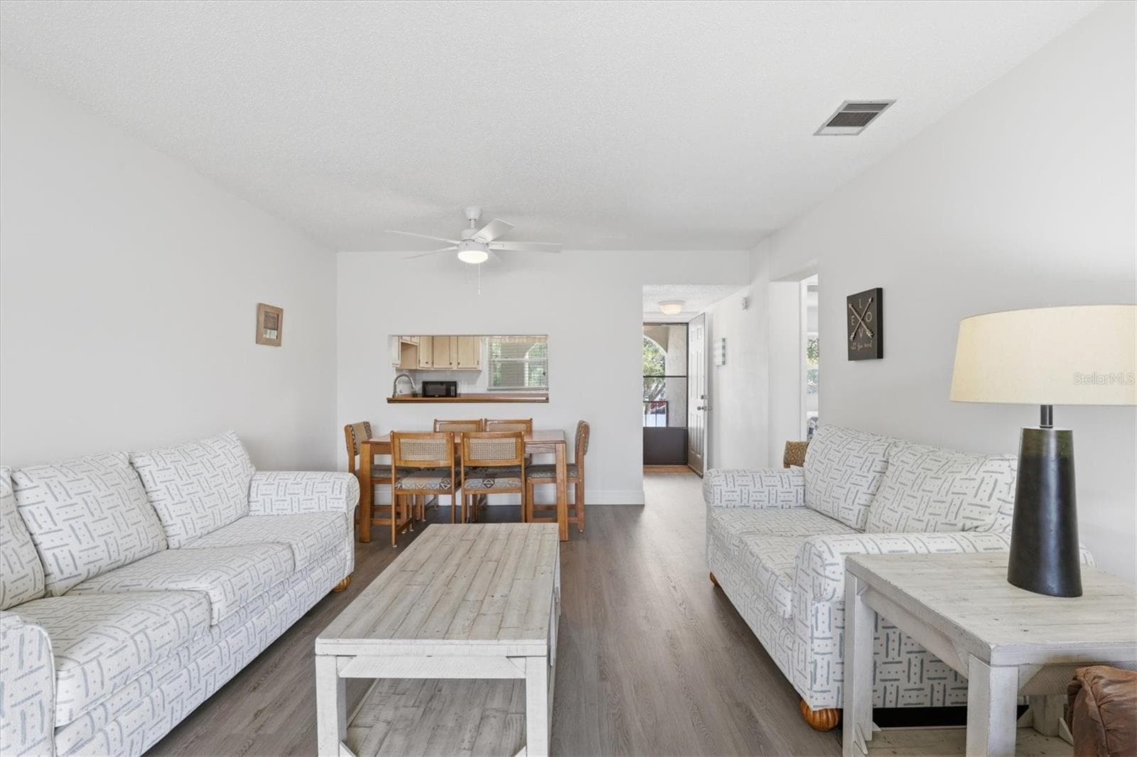 Full view of dining and living room - 7701 STARKEY RD #412, SEMINOLE