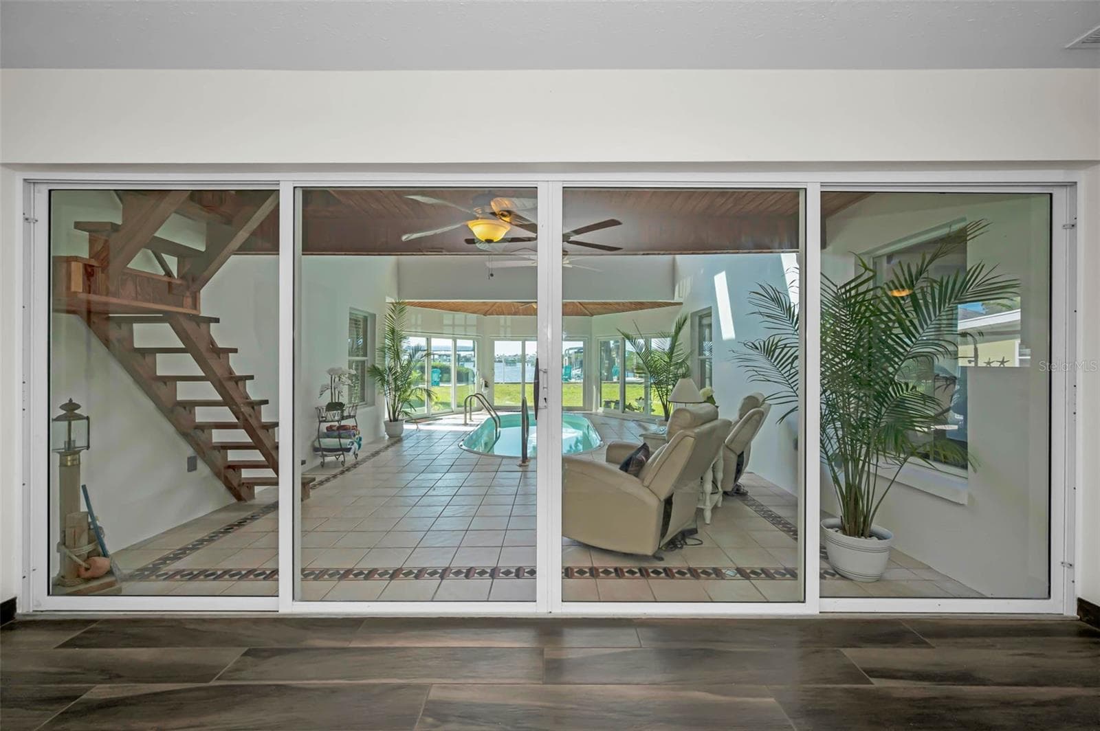 These sliders can be open or closed. Pool area in under A/C - 1626 SEA BREEZE DR, TARPON SPRINGS