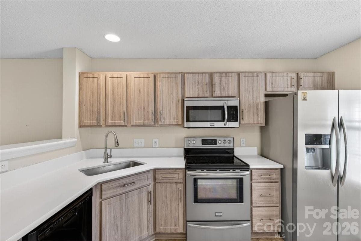 The updated kitchen includes the refrigerator too. - Charlotte