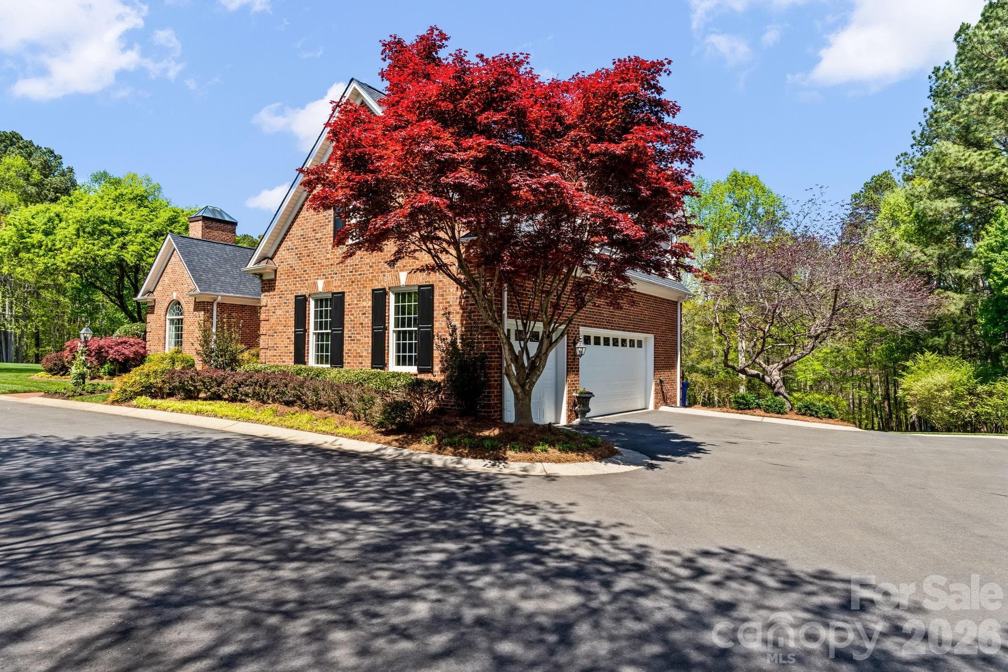 Recently paved circle drive to heated 3 car garage - Lewisville