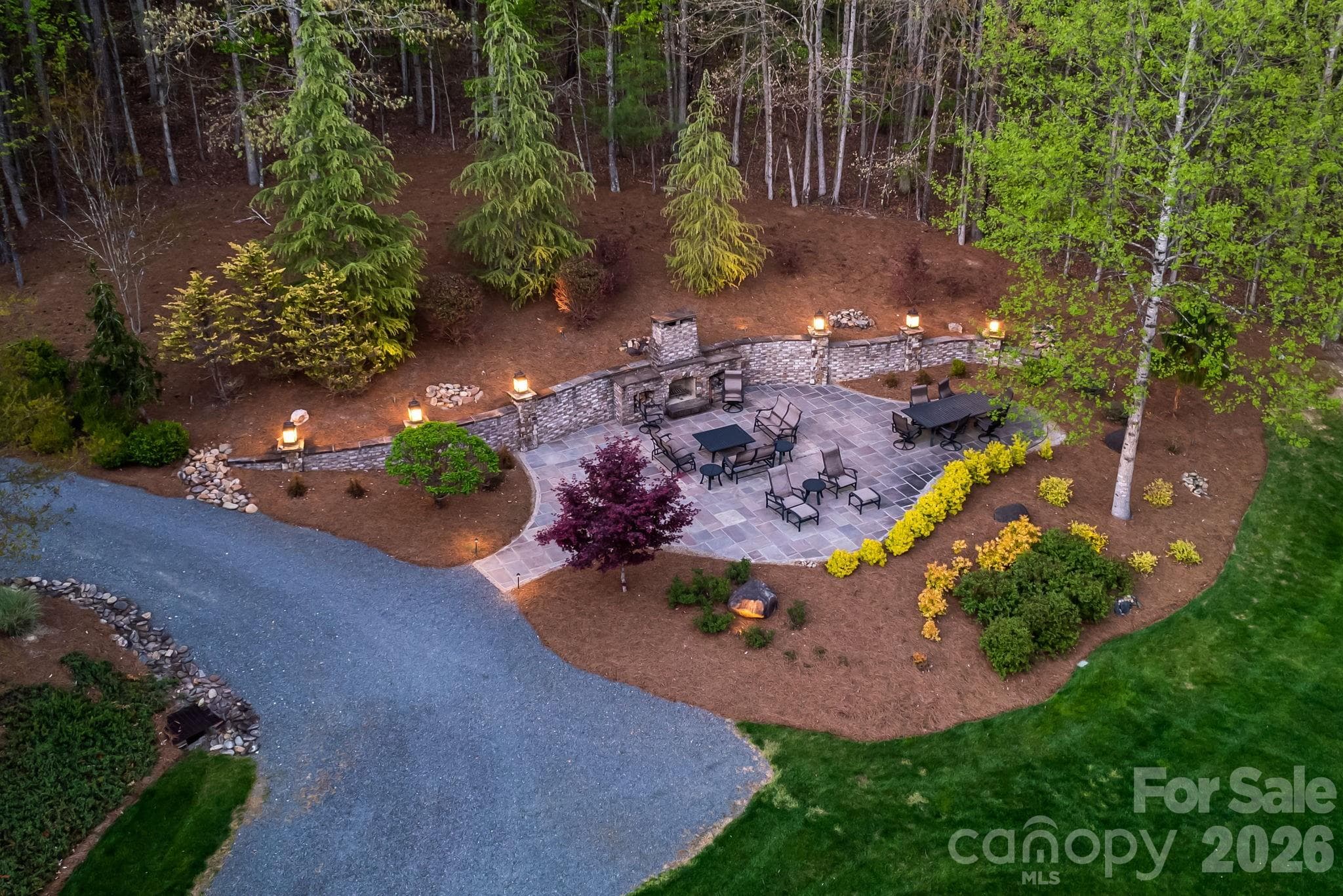 Enjoy the outdoor fireplace with evening fires and lovely landscaping - Lewisville