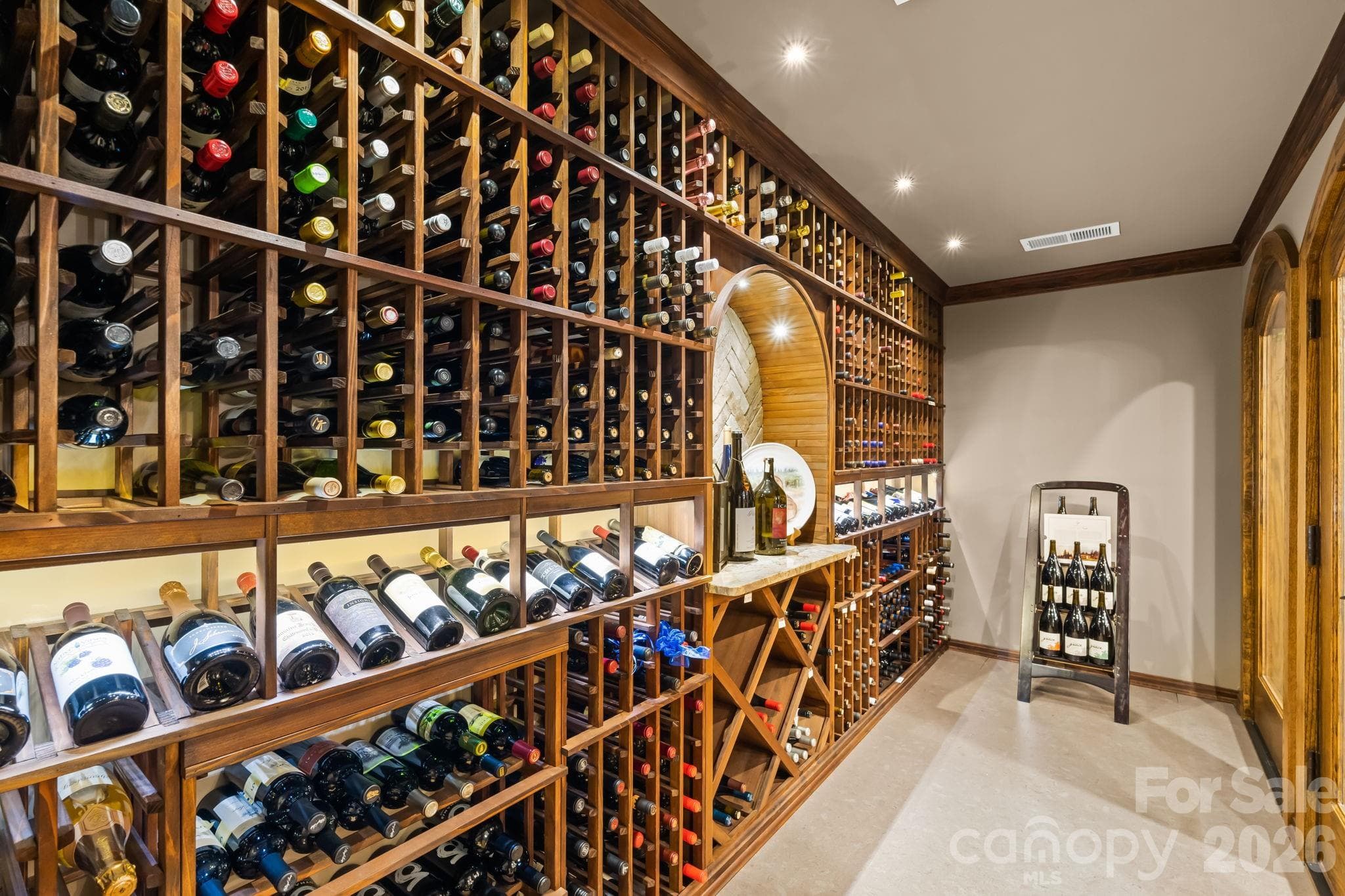 Humidity controlled wine cellar boasts cork floors and houses 775 bottles. - Lewisville