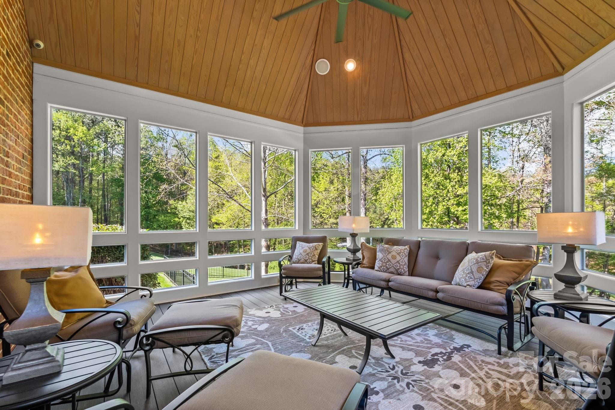 The exceptional screened porch with low maintenance decking and vaulted ceiling offers extensive views of the property - Lewisville