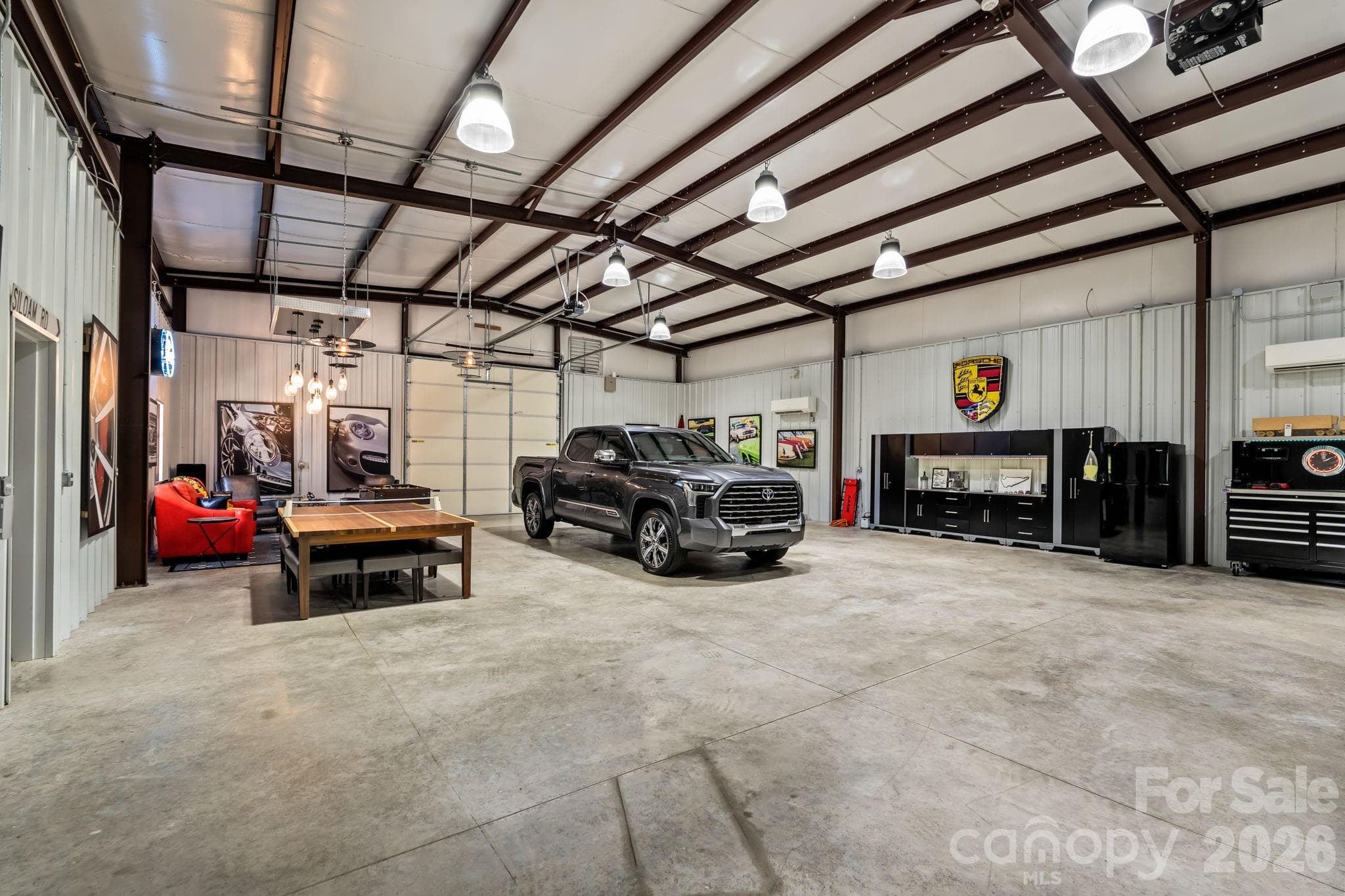 Heated and cooled by dual mini splits, LED lighting, Sonos sound system, alarm, bathroom, garage bays, and separate septic system - Lewisville