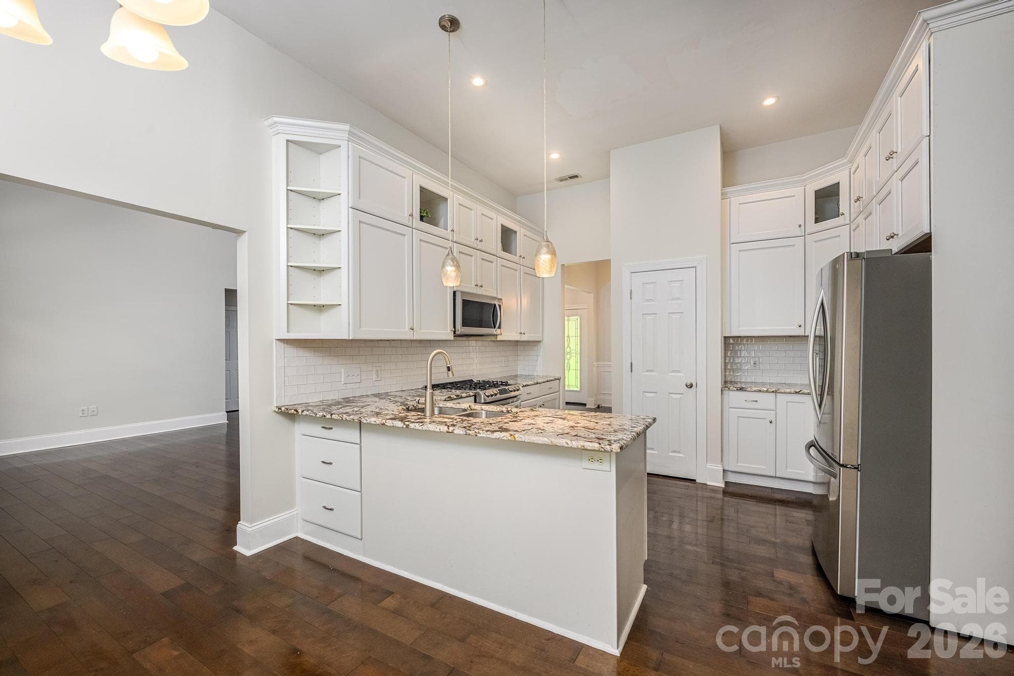 Kitchen w/Stainless Appliances & Tile Backsplash - Denver