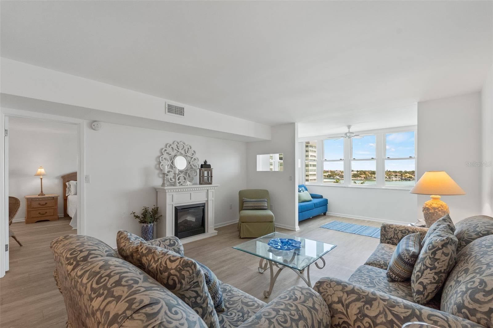 Open Living Room with Electric Fireplace - 5130 BRITTANY DR S #505, ST PETERSBURG