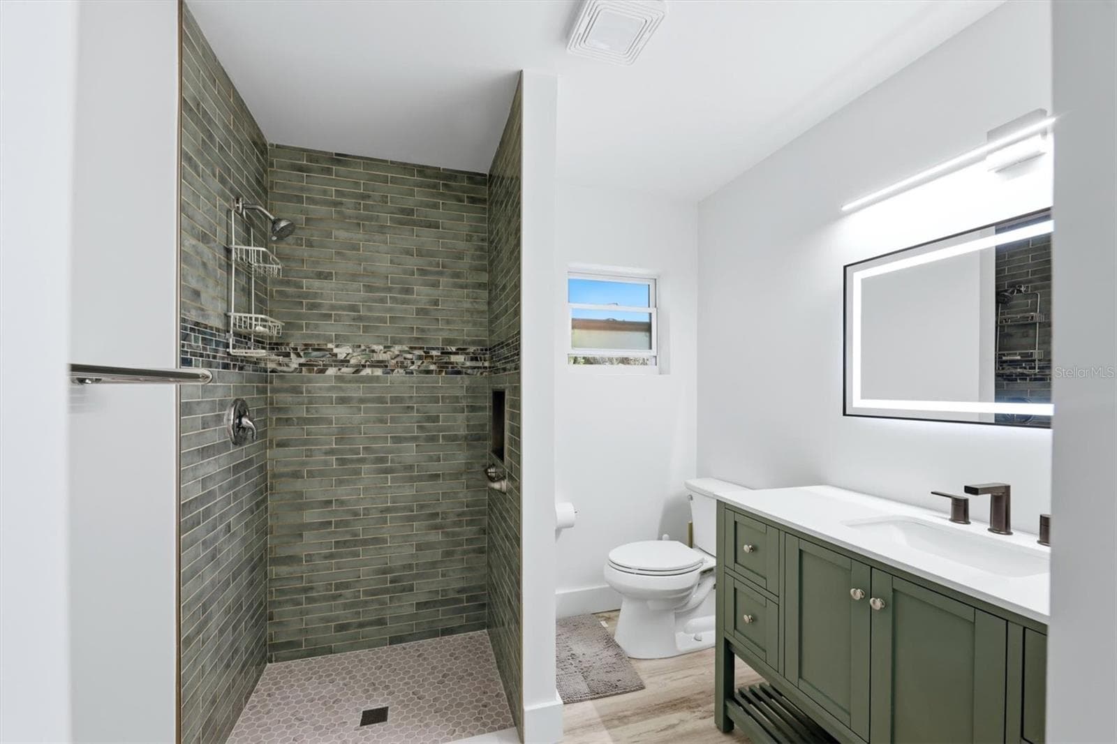 Brand new primary bathroom. Beautiful tiled shower. - 4003 BOOTH PL, SARASOTA