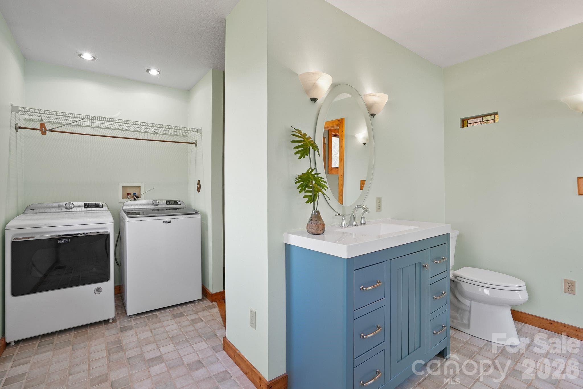 Primary bathroom includes laundry area and walk in closet around the corner - 310 Burr Ridge, Marshall