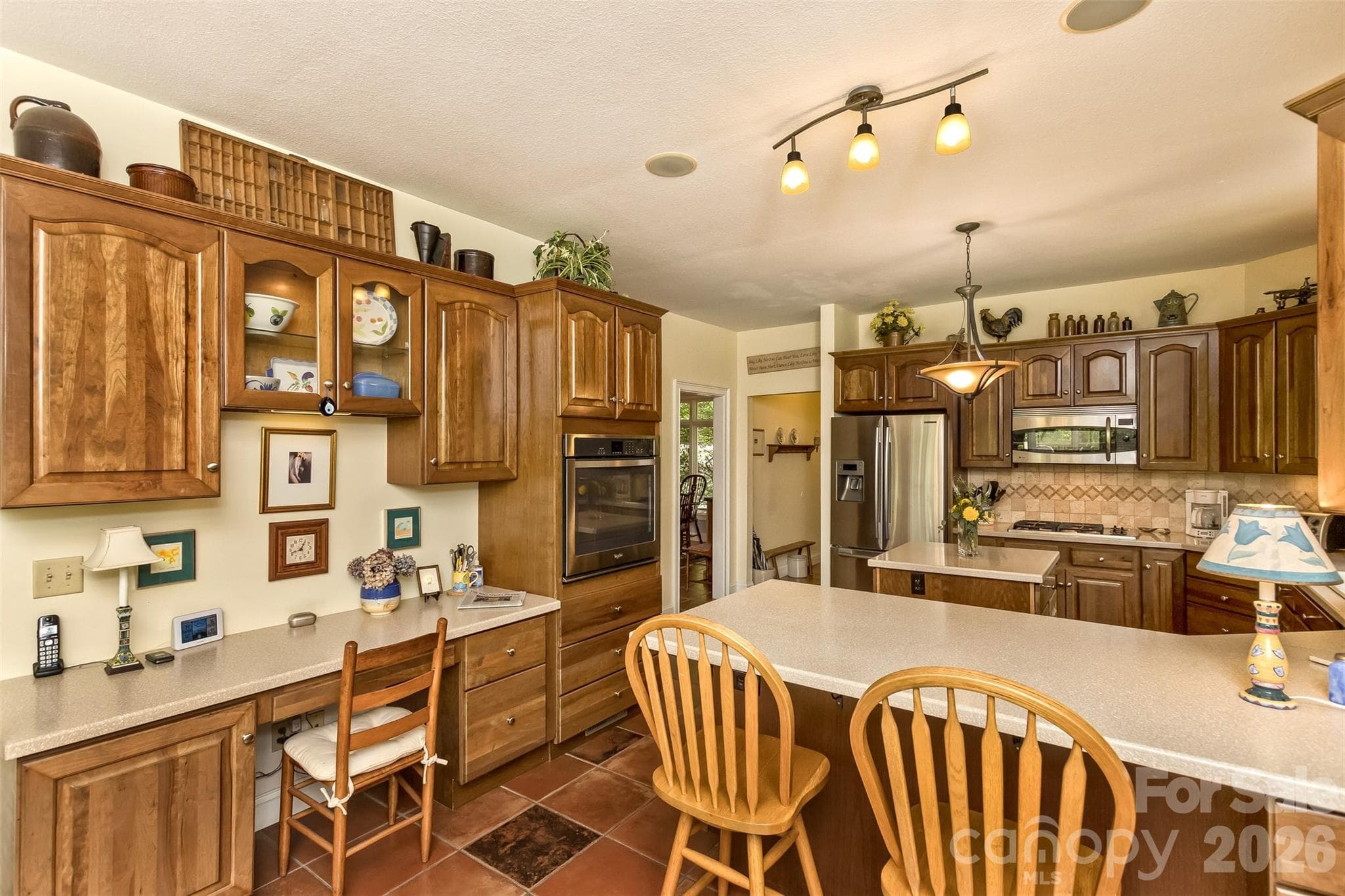 Kitchen also includes a desk area! - 25 Windsong Drive, Fairview