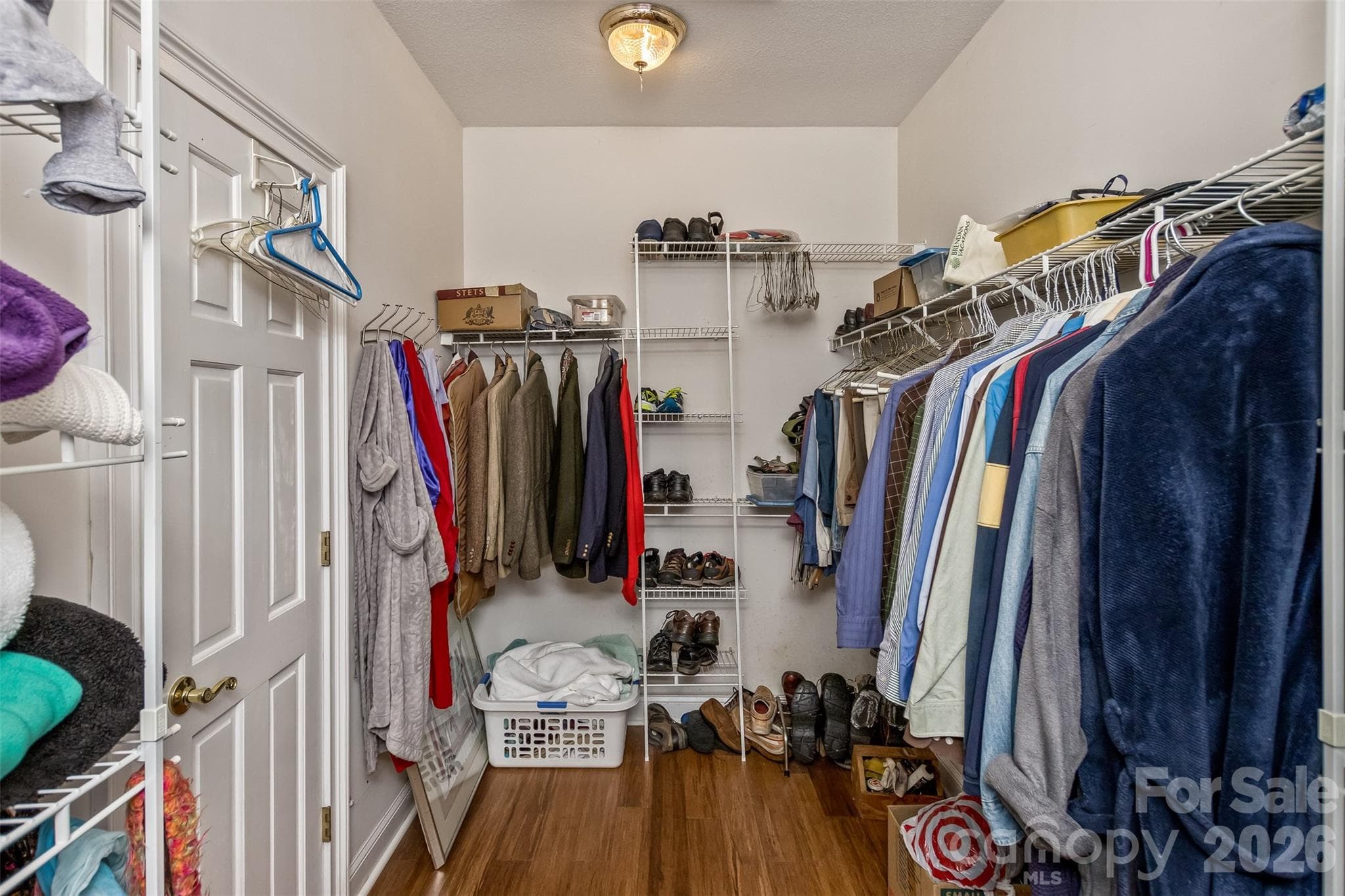 One of two closets adjacent to the primary suite - 25 Windsong Drive, Fairview