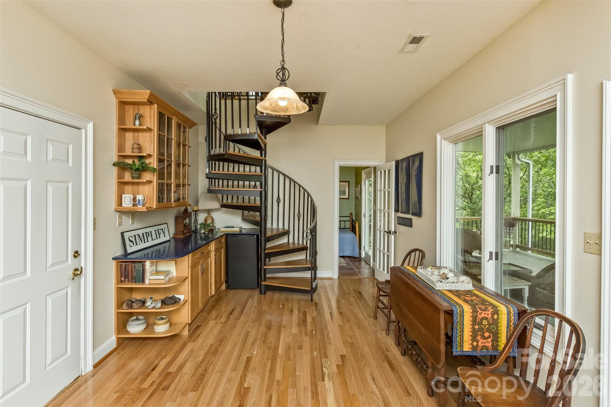 Downstairs, find two staircases to upstairs. Lots of built ins with access to double garage - 25 Windsong Drive, Fairview