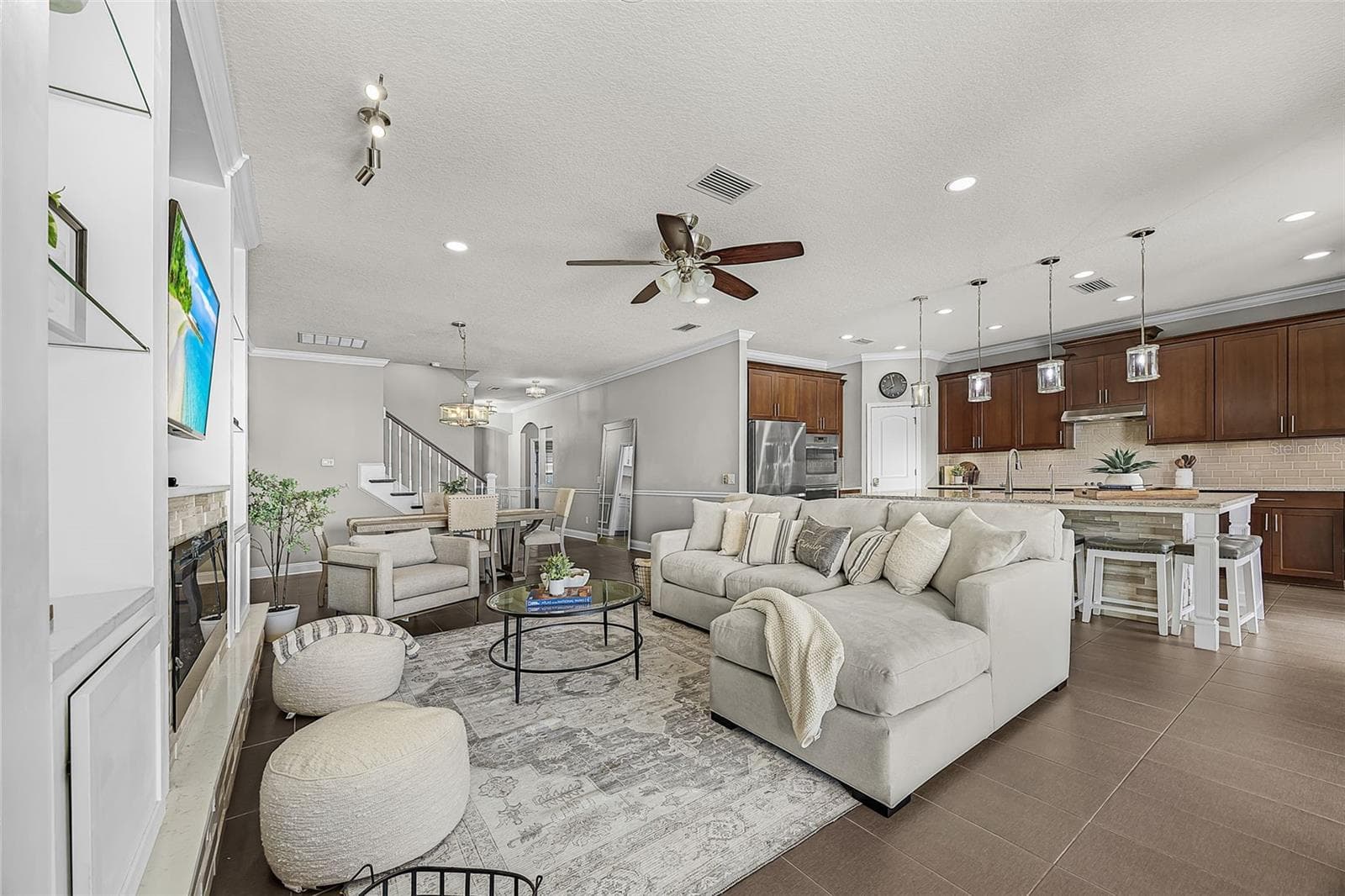 Open concept living/dining/kitchen- Actual - 835 129TH ST NE, BRADENTON