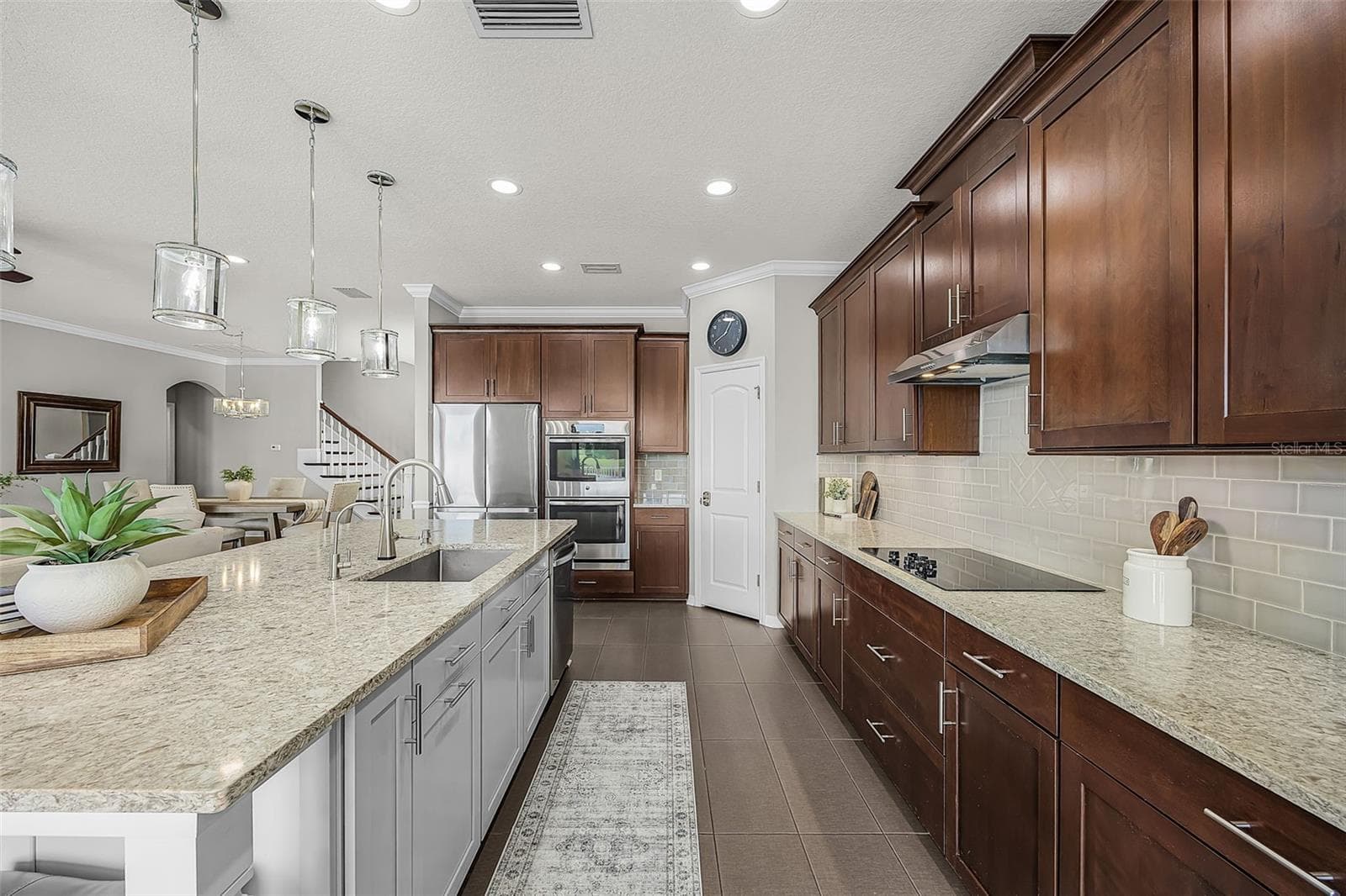 Kitchen overlooking pool and pond - 835 129TH ST NE, BRADENTON