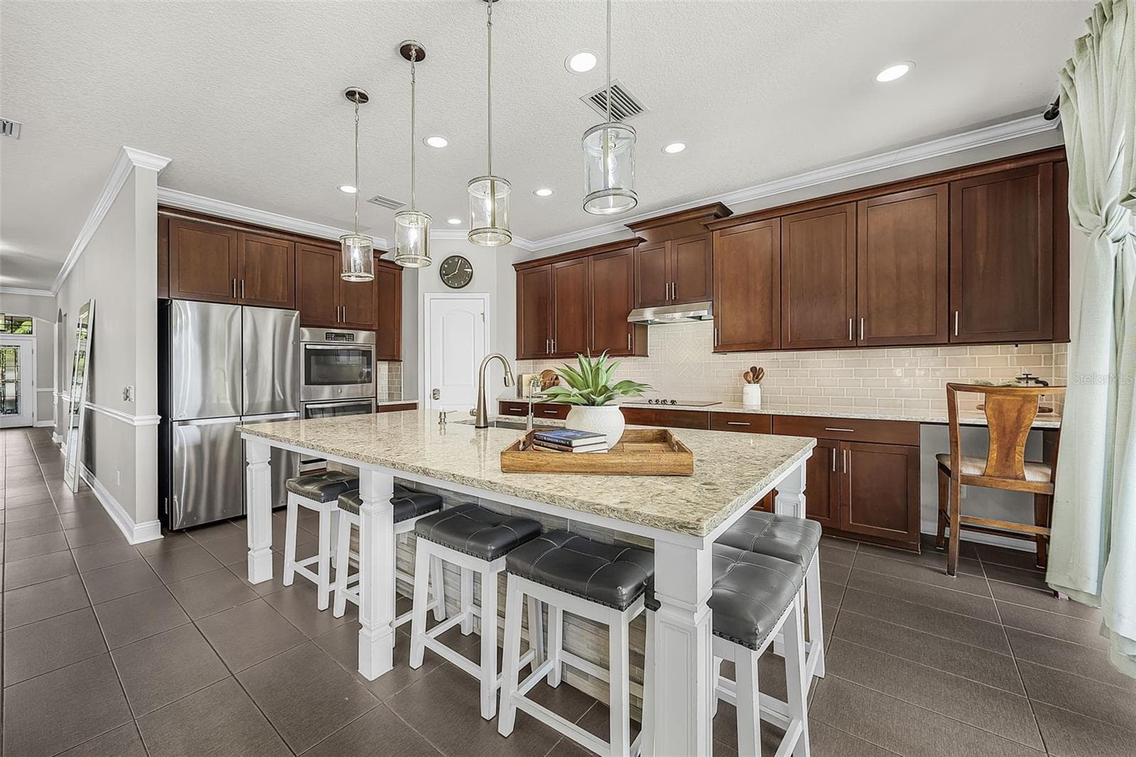 Kitchen overlooking pool and pond - 835 129TH ST NE, BRADENTON