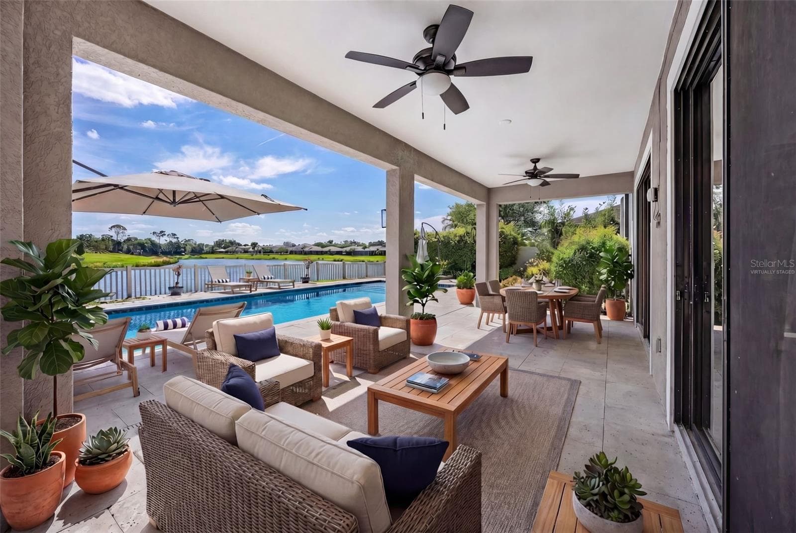Covered Porch- Enter through both the Kitchen and the Living Room- VIRTUALLY STAGED - 835 129TH ST NE, BRADENTON