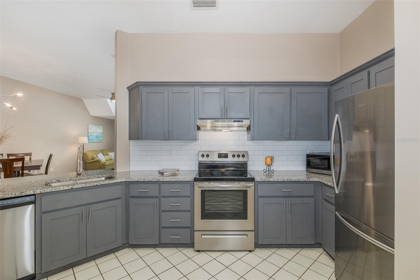 Kitchen open to Living area - 3843 GOLDFINCH CT, PALM HARBOR