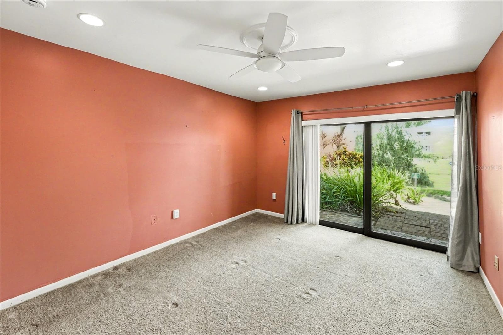 Master Bedroom (Ceiling Fan, Sliding impact resistant door to outdoor patio) - 10755 VILLAGE CLUB CIR N #101, ST PETERSBURG