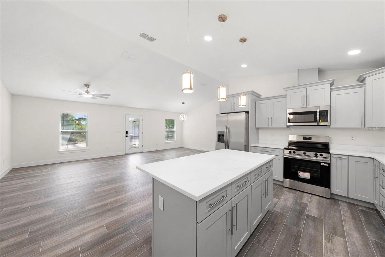 Kitchen looking into the Living Room/Dining Room - 5062 80TH LN N, ST PETERSBURG