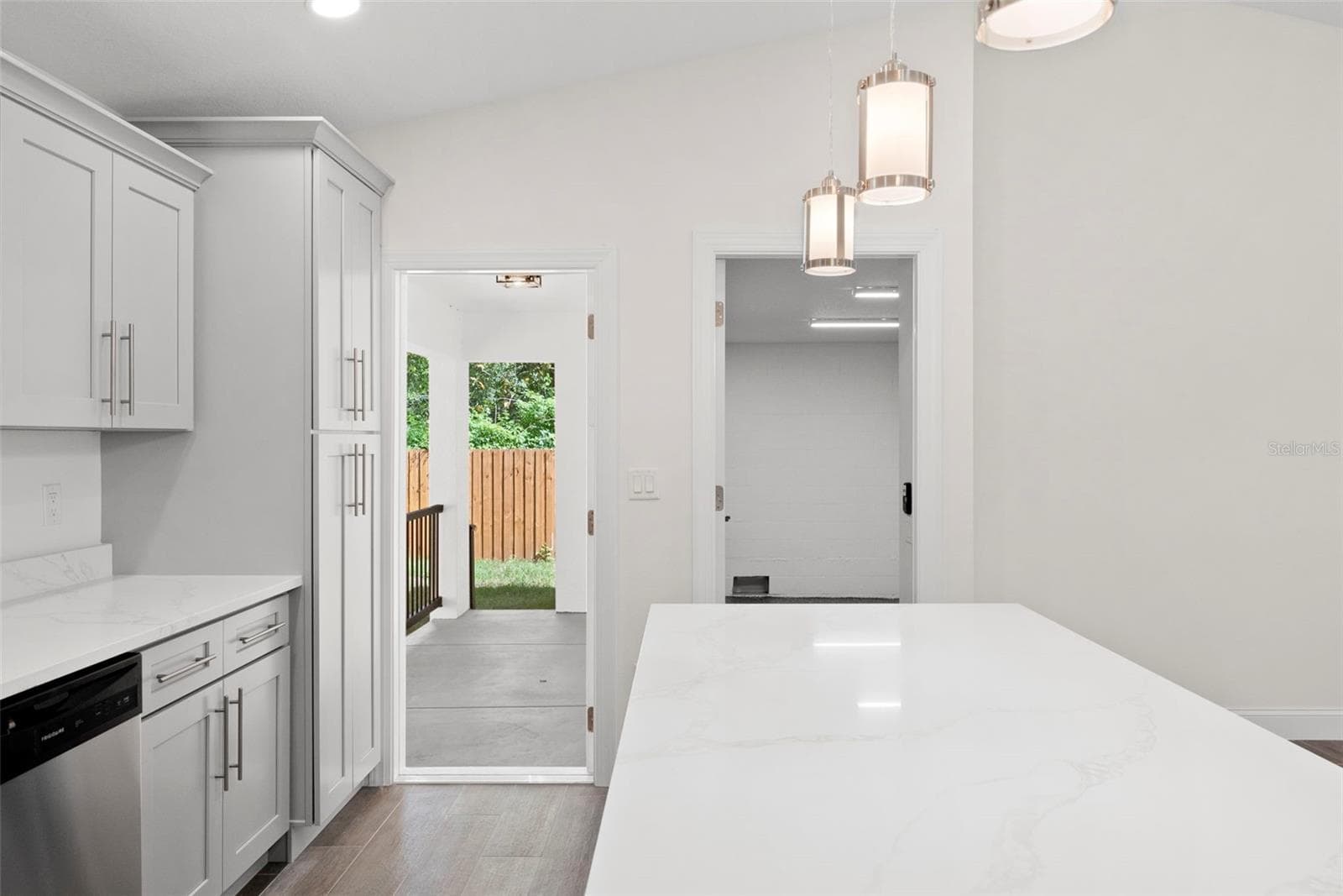 Kitchen: Left Door to Rear Porch, Right Door to Garage - 5062 80TH LN N, ST PETERSBURG