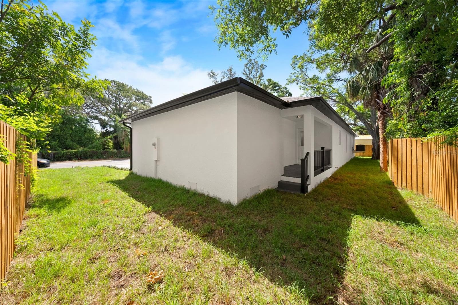 North side of home and Backyard - 5062 80TH LN N, ST PETERSBURG