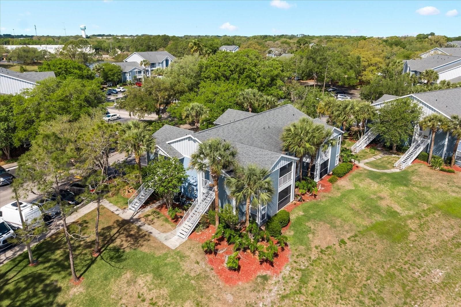 Unit 103 can be entered using the walkway path to the left. - 2501 GRASSY POINT DR #103, LAKE MARY