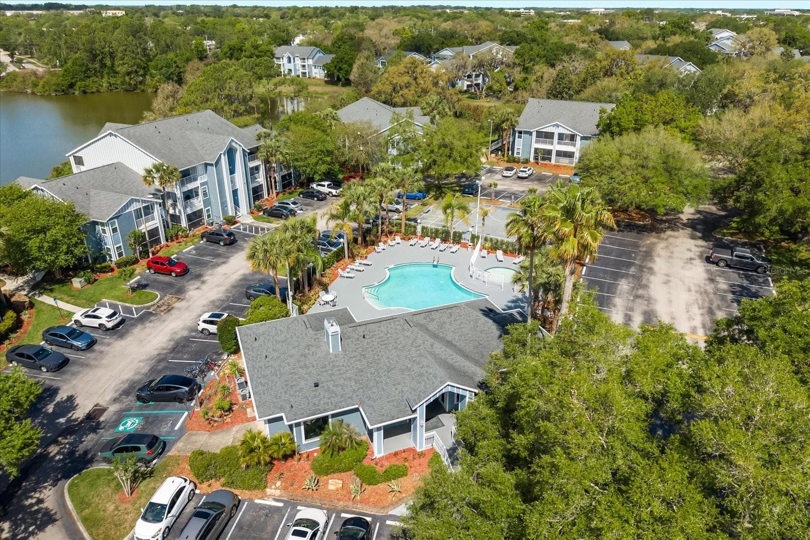 Community features 2 pools, clubhouse, 2 fitness centers, tennis courts, community dock, 2 gates and more... - 2501 GRASSY POINT DR #103, LAKE MARY