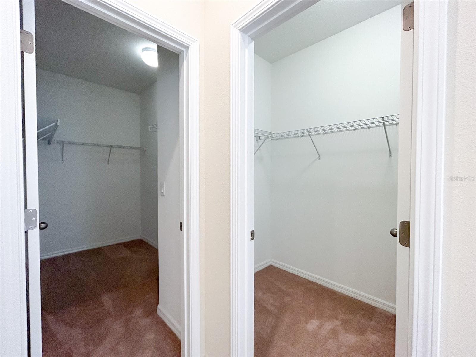 Primary bath with two separate walk-in closets with individual - 13814 BEE TREE CT, HUDSON