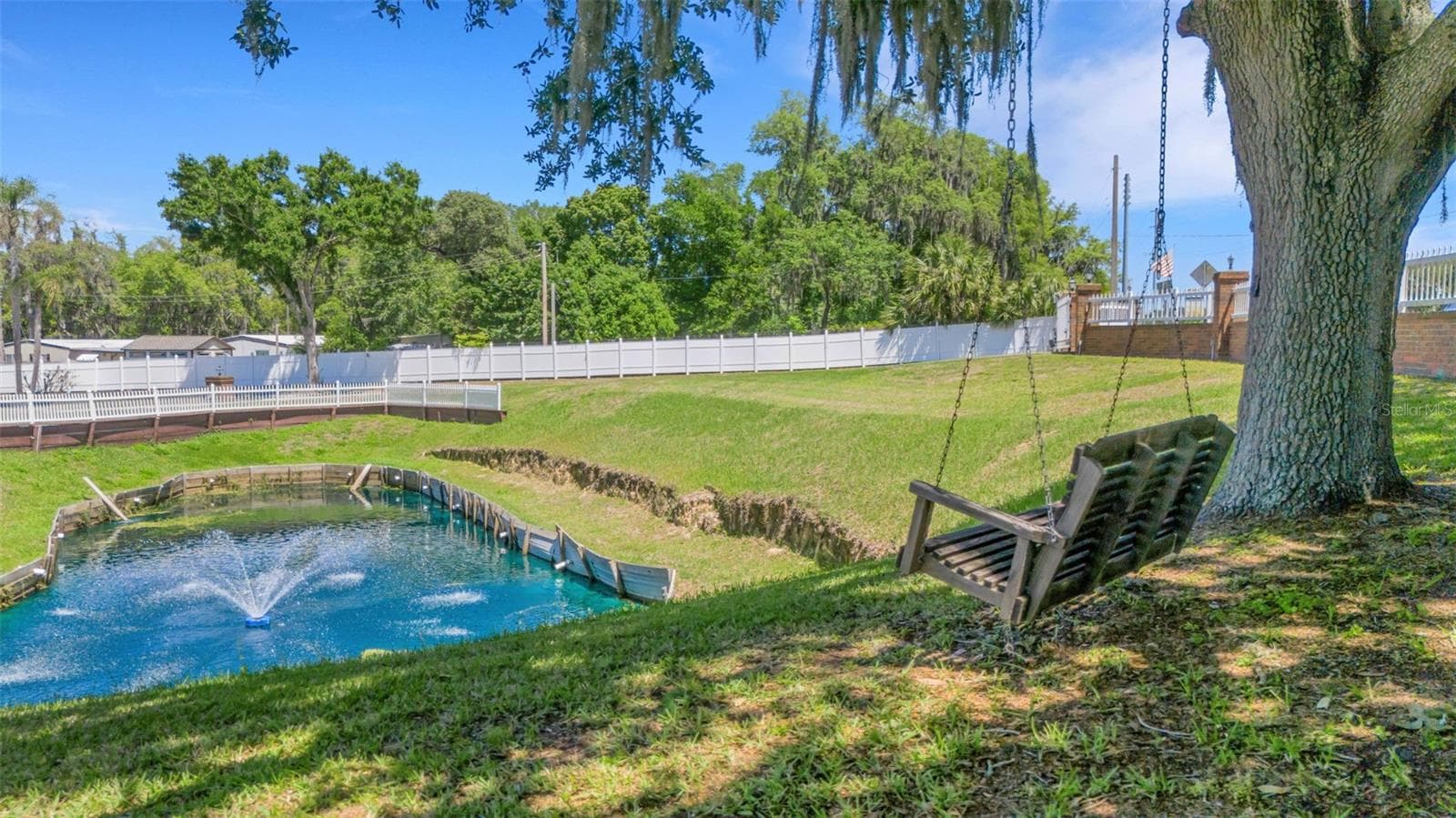 This captivating property sits on 1.32 acres with a sweeping circular driveway and gate entrance. - 5905 MAGNOLIA LN, LAKELAND