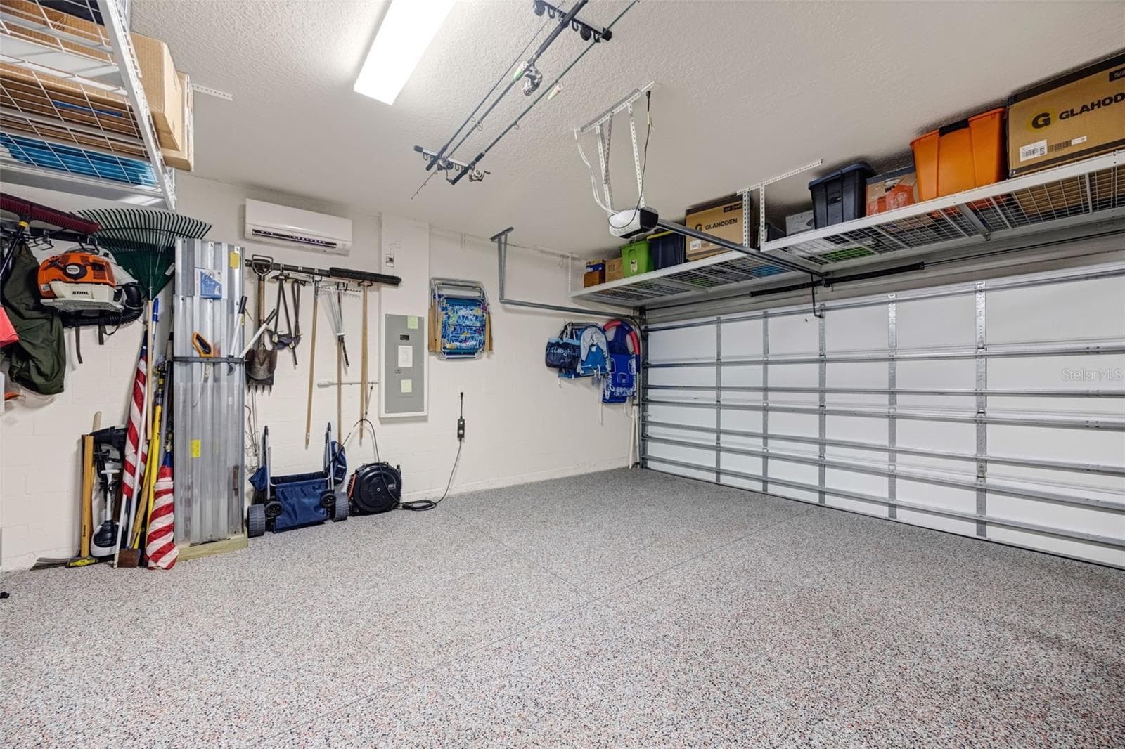3 car garage with epoxy flooring and separate AC system - 5526 GAVELLA CV, PALMETTO