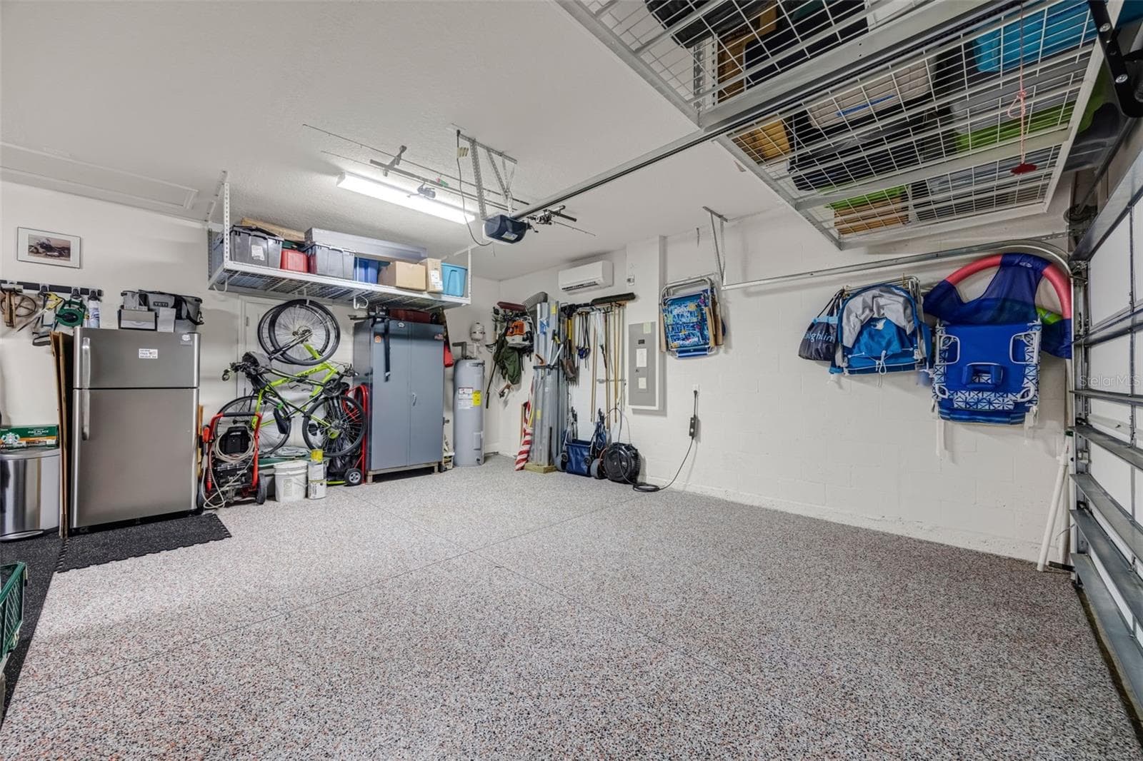 3 car garage with epoxy flooring and separate AC system - 5526 GAVELLA CV, PALMETTO