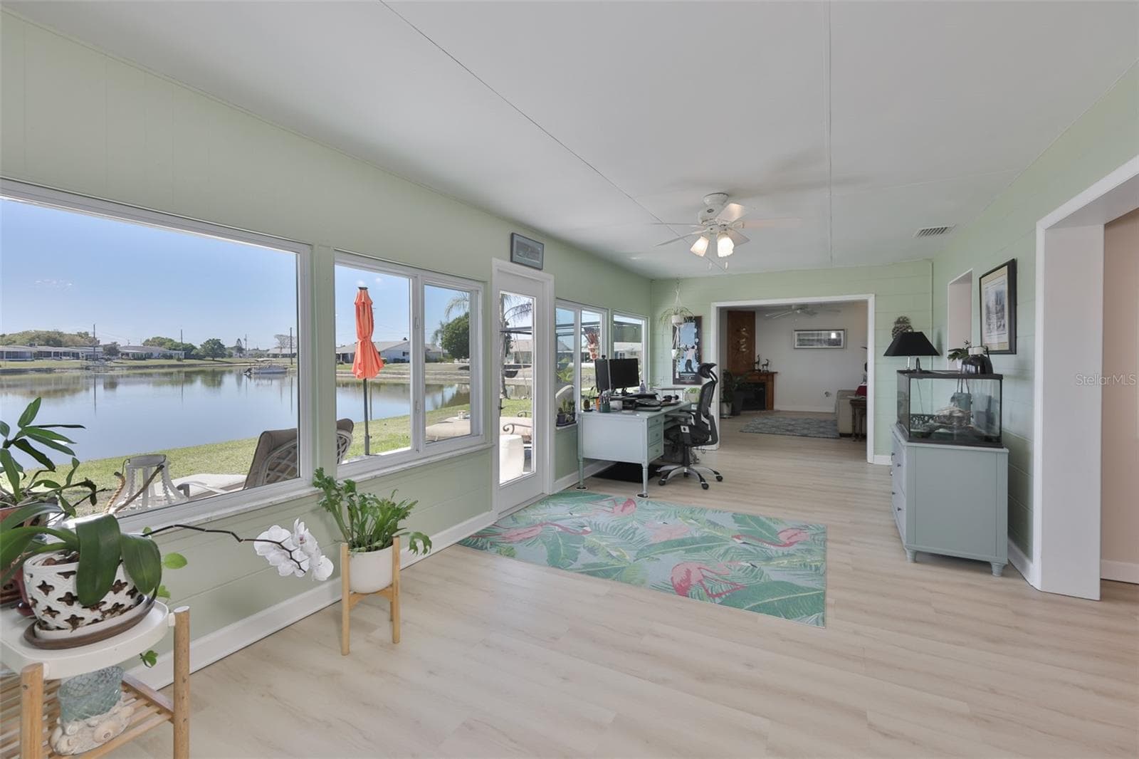 Enclosed Lanai-Newer Windows & Door, Tons of Light & Peaceful Lake Views - 1704 DANBURY DR, SUN CITY CENTER
