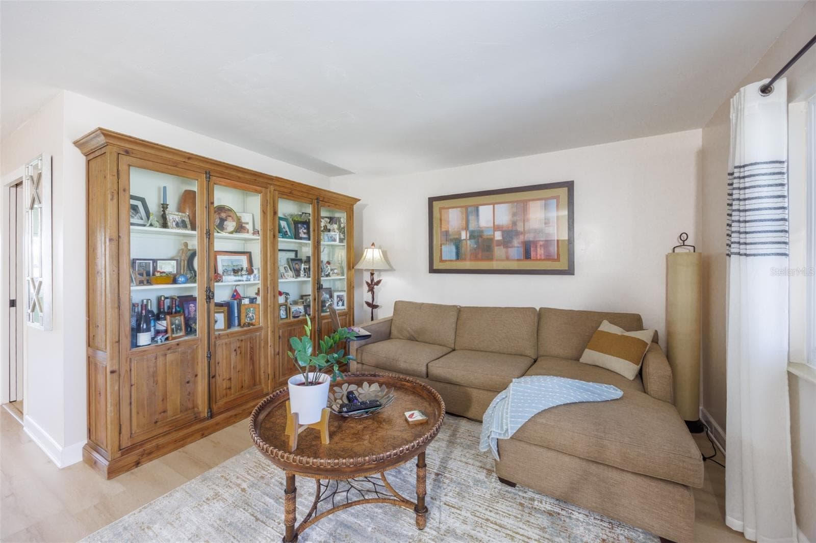 Front Living Room, Modern LVT Plank Flooring Throughout Main Living Area - 1704 DANBURY DR, SUN CITY CENTER