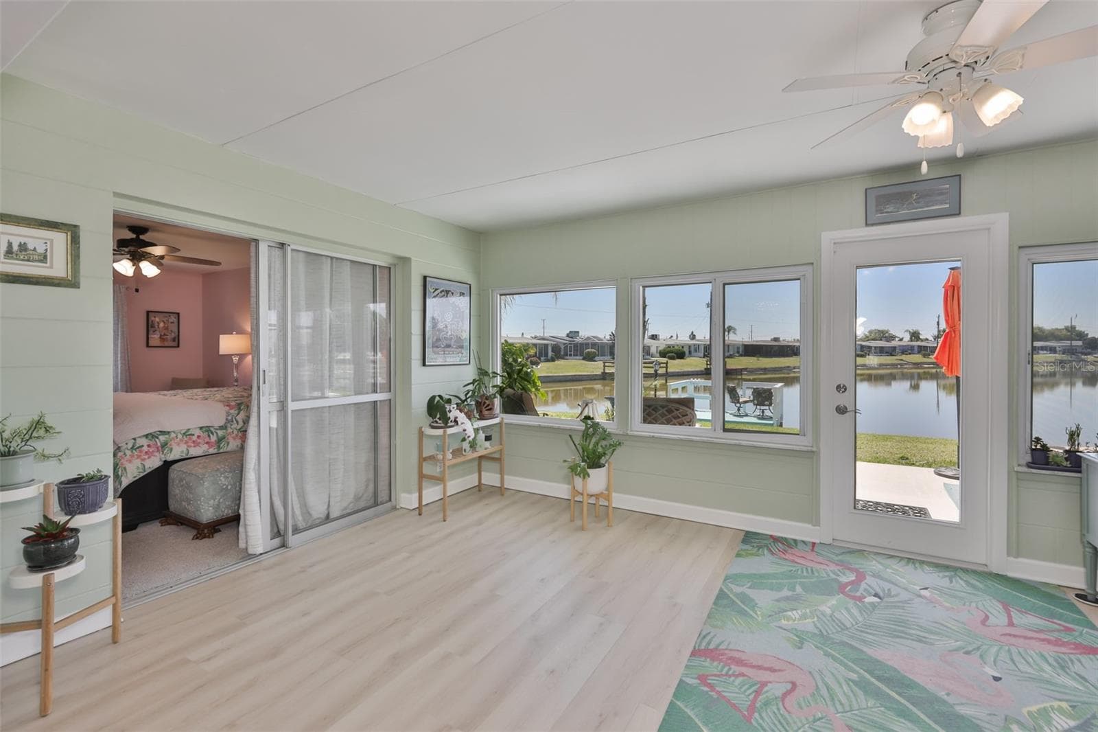 Enclosed Lanai, Modern LVT Plank Flooring, Newer Windows, Breathtaking South Lake View - 1704 DANBURY DR, SUN CITY CENTER