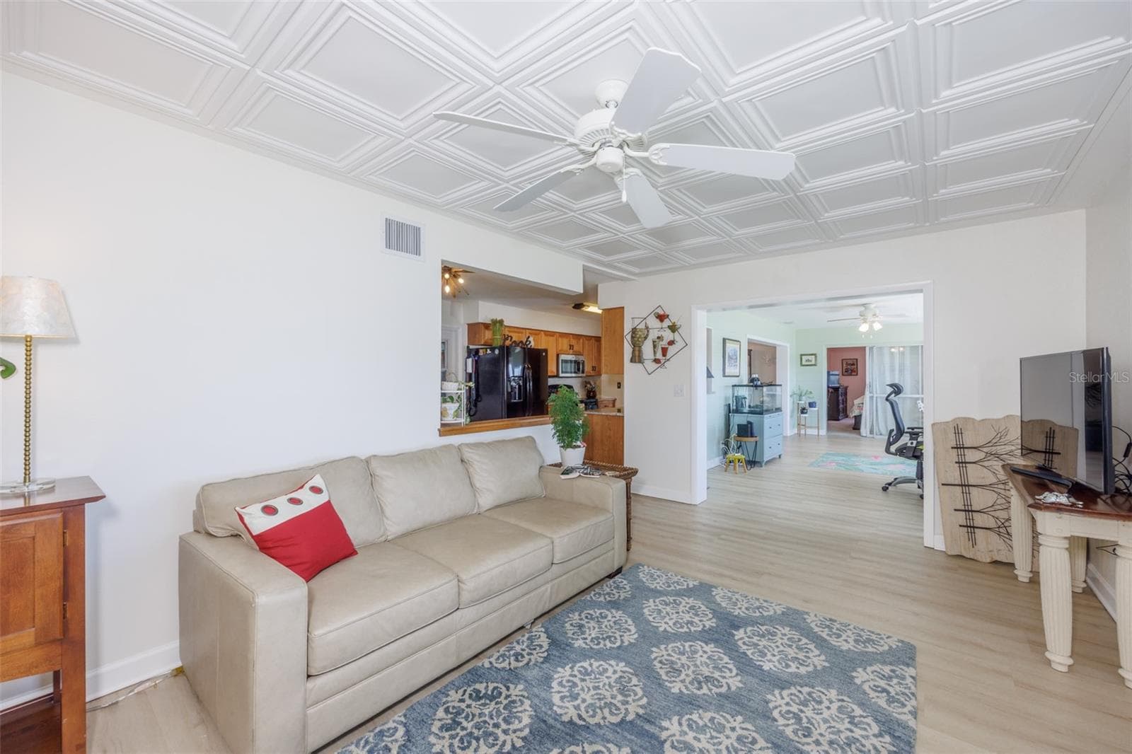 Great Room, Classic Elegance Coffered Ceiling & Electric Fireplace, LVT Plank Flooring - 1704 DANBURY DR, SUN CITY CENTER